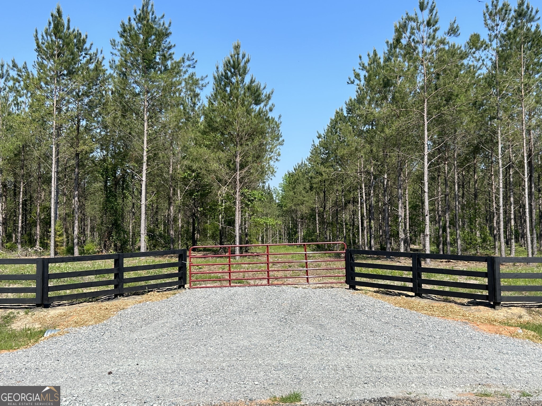 Bluewater offers 19 beautiful country homesites designed for peaceful living in a natural setting. Lot #8 features 5.988 wooded acres with a small creek along the back property line, creating a serene and private environment. This gated community includes protective covenants, paved road frontage, and access to an excellent public school district. Located just minutes from downtown Dublin and only 6 minutes from Interstate 16, Bluewater is ideally situated halfway between Atlanta and Savannah. With convenient access to shopping, dining, and entertainment, along with a thriving local economy, this homesite is perfect for building your dream home, raising a family, and enjoying the laidback country lifestyle.