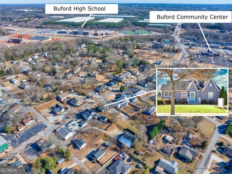 This unique commercial property is located in the heart of Downtown Buford, a vibrant and sought-after destination known for its charm and bustling atmosphere. Situated in a prime location with sweeping access to Mall go Georgia, Lake Lanier, and Downtown Buford itself. This property combines the convenience of a residential home with the potential for commercial use, offering versatile opportunities for business owners or investors. The home/office is a 3 bedrooms, 1 bathroom, and an open, inviting floor plan that seamlessly blends residential comfort with commercial potential. Large windows throughout the property, creating a welcoming atmosphere for customers and residents alike. With a prime street frontage, the property offers high visibility and easy access for both foot and vehicle traffic. Zoned for mixed-use, it provides endless possibilities, whether as a boutique business, art gallery, cafe, or office space, while maintaining its residential character. The exterior features allow plenty of parking spaces & walking accessibility. This property's location in downtown Buford adds tremendous value, with nearby attractions, restaurants, and shops contributing to its appeal for both business and residential purposes. Ideal for those looking to work in one of the most desirable areas of Buford, it offers an exceptional opportunity to capitalize on the growing demand for properties that blend home and commercial space.