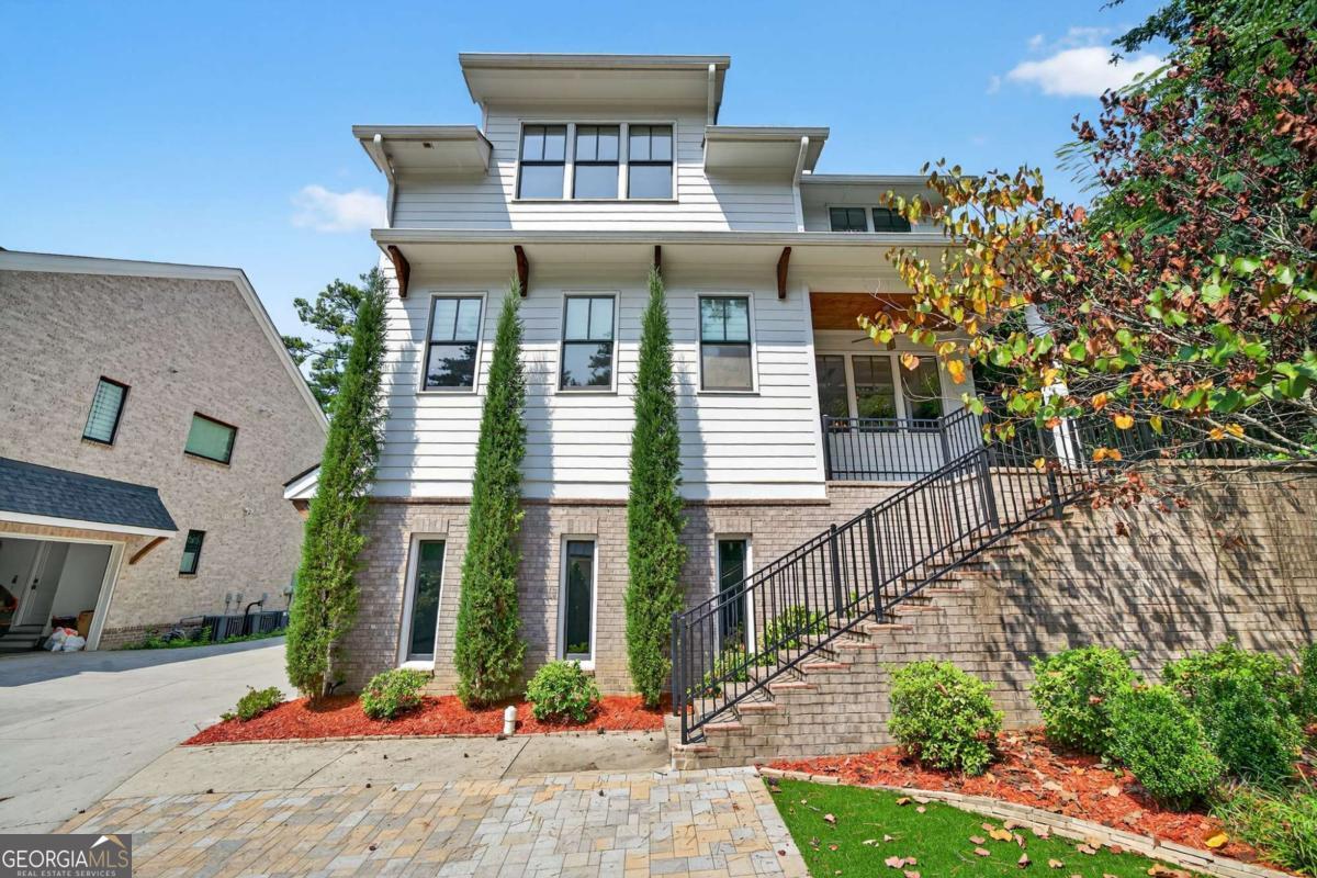 Welcome to your oasis in the heart of desired Ashford Park - minutes from all that Chamblee, Brookhaven, and Atlanta have to offer. Perched on a quiet, private, tree-lined lot, this like-brand new home features every bell and whistle imaginable and will wow you from the moment you walk in the door. Featuring SIX spacious BEDROOMS, FIVE luxurious FULL BATHS, 4200 square feet of living space, and the most incredible BACKYARD PARADISE you'll see in the area, no detail was overlooked in the customization and upgrading of this home. Bright, open floorplan with incredible CHEF'S KITCHEN... the OUTDOOR SPACE truly must be seen to be believed... the wellness & entertainer's paradise features fabulous BACK PORCH, totally private, FLAT, FENCED, usable, TURF BACKYARD with custom stone paver patio, 5-person jacuzzi, firepit and infrared/red light SAUNA, OUTDOOR SHOWER, newly added under-deck storage and more... FINISHED BASEMENT with NEW LVP, home gym, NEWLY RENOVATED full bath, bonus living space, storage and more... this home epitomizes luxury living from the moment you walk in the door. Two-car garage with epoxy floors offers plenty of space plus additional, NEWLY paved parking pad... NEW light fixtures and hardware all throughout... NEWLY upgraded, painted island, bar area, deck and more... Located in Chamblee/Brookhaven's jewelbox, Ashford Park, enjoy easy access and walkability to so much that the area has to offer... minutes to Downtown Chamblee, Brookhaven Village, I-85, Buckhead, Midtown, so many favorite restaurants, shops, parks, schools and more.