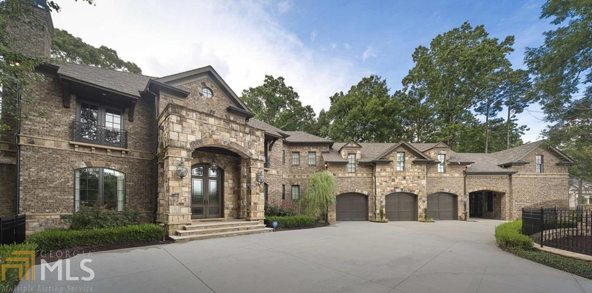 Gated estate on corner lot in N. Buckhead is stunning departure from ordinary. Soaring two story foyer w/silver leaf dome & dramatic staircase make memorable statement. Dining Room w/enchanting Venetian plaster walls. Casual opulence in kitchen & keeping room overlooking resort like cabana, pool, sport court. One-of-a-kind 1,000 s.f. master closet is glamorous & functional w/room for 300+shoes. Plenty of room for entertaining in guest home & sleek finished basement. Shiny surfaces, muted colors, & sensual fixtures were carefully selected to maintain drama and warmth.