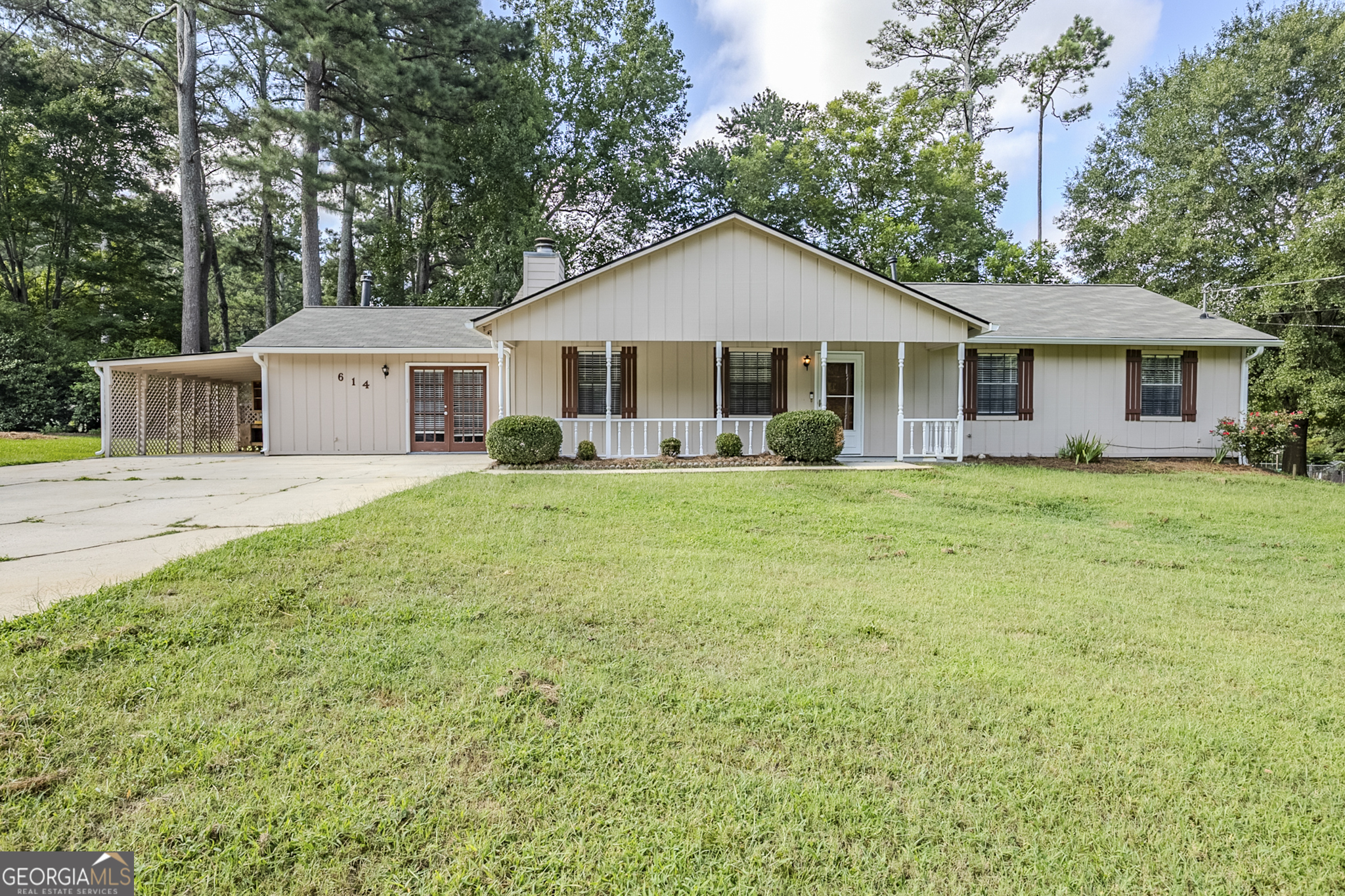 Welcome home to this charming 3-bedroom, 2-bathroom ranch nestled in a quiet Fairburn neighborhood. Enjoy relaxing mornings on the covered front porch, welcoming you into a bright and inviting interior. Step inside to find a spacious family room with a cozy fireplace, perfect for gatherings and relaxing evenings. The renovated kitchen is a true highlight, featuring a beautiful tiled backsplash, new quartz countertops, new sink and faucet, and stainless steel appliances, providing both functionality and style for daily living and entertaining. A bonus room with a gas-burning stove offers versatile space for a second living area, office, or playroom. The primary bedroom features a walk-in closet and private bath, creating a comfortable retreat at the end of the day. Two additional bedrooms are perfect for family or guests and share a fully renovated bathroom. Recent updates include fresh interior paint, new carpet, and renovated bathrooms, ensuring this home is move-in ready with modern touches throughout. Enjoy the outdoors on the large patio overlooking the spacious backyard, complete with a storage shed painted to match the home, offering additional storage and curb appeal. Conveniently located near schools, parks, shopping, and dining, this home combines comfortable living with everyday convenience. Schedule your showing today and make this updated Fairburn ranch your new home!