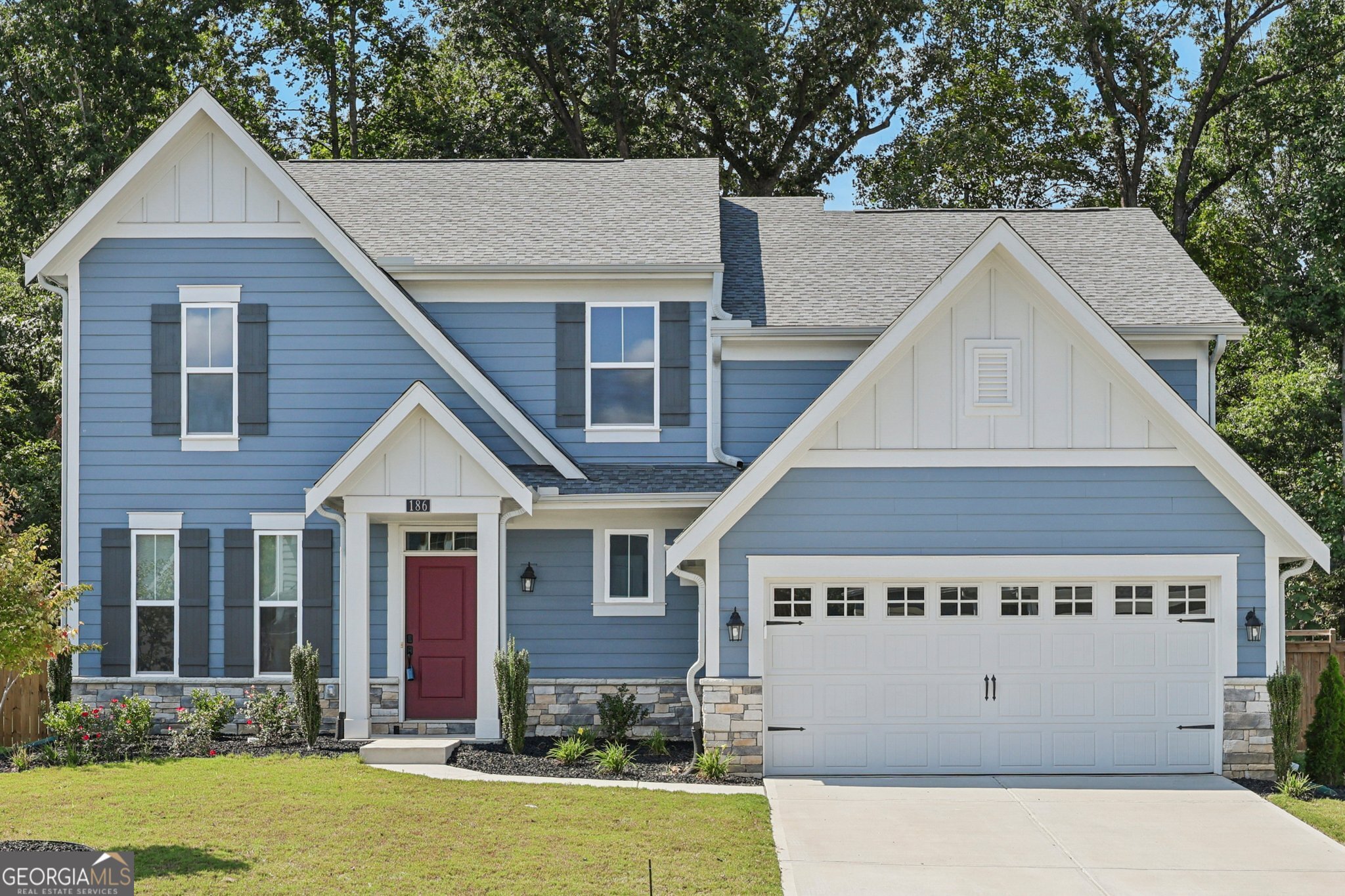 Welcome to this beautiful 5-bedroom, 3.5-bathroom home in Braselton, GA, offering comfort, style, and convenience in a sought-after gated community with a pool, clubhouse, and walking trails. Just minutes from downtown Braselton and close to Chateau Elan Golf Club, this home places recreation, entertainment, and dining right at your fingertips. Inside, the bright and open floor plan features large windows with serene wooded views, filling the home with natural light. The modern kitchen boasts upgraded appliances, making it the perfect space for cooking and entertaining. The primary suite upstairs provides a spacious private retreat, while the lower-level guest bedroom with full bath is ideal for in-law quarters or overnight guests. Enjoy outdoor living in the flat, fenced backyard, perfect for gardening, play, or simply relaxing in your own private oasis. Blending modern upgrades, thoughtful design, and resort-style community amenities, this Braselton home has everything you need to live, entertain, and thrive.