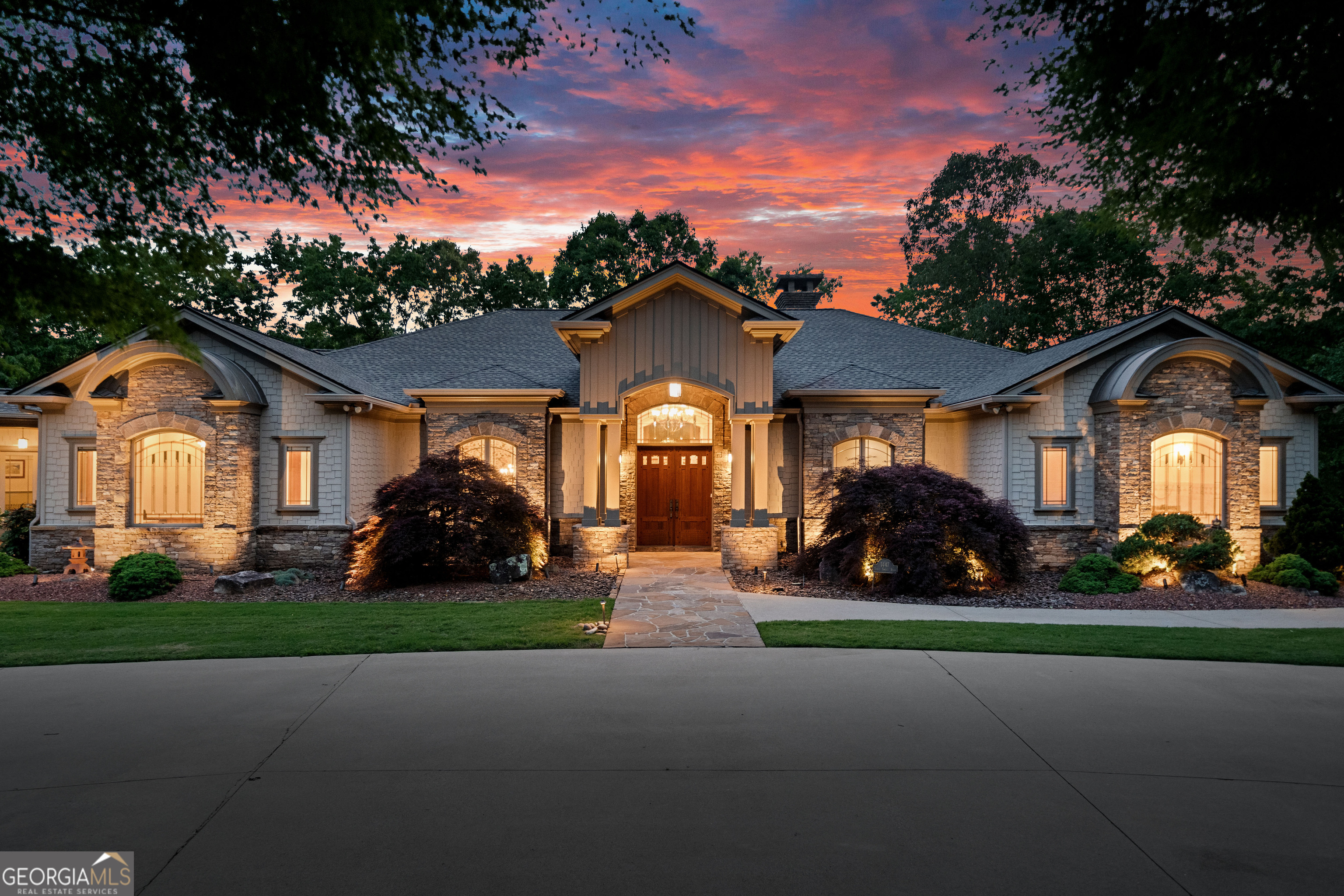 Ultra Private 175 Acre Estate with 5BD, 4.5BA, 8600sqft Luxury Craftsman Home, 5-Stall Horse Barn, Covered Riding Arena, Cottage Home, Fenced Pastures, Pond, Streams and Waterfall, and Nearly One Mile of National Forest Frontage! Meticulously designed and crafted in the authentic American Arts and Crafts Style, the home has a timeless grace that features a beautiful blend of natural materials, showcase woodworking, and unparalleled finishes: 8' solid interior doors throughout, wide-plank heart pine flooring, furniture grade built-ins and maple cabinetry, Pella architectural windows and doors, and exceptional millwork. Oversized great room has gorgeous dry-stack stone masonry fireplace and pine-paneling, exposed beams. The living area flows outside onto the full-length back porch overlooking the pond. Entertainers' kitchen has panel-front fridge, hidden walk-in pantry, beverage center, two-tier granite island with bar seating, breakfast area, keeping room, and Wolf 6-burner commercial range with hood and grill. Luxurious owners' suite has tray ceilings and barrel vaults, mood lighting, his and hers custom closets, his and hers vanities, and spa tub. 4575 sqft main level also has formal dining area with butler's pantry, parlor room, dedicated office with half bath, laundry, and second bedroom suite. Terrace level hosts game and media room, full kitchen, three bedrooms and two baths, stone patio and veranda, utility rooms, storage and finished flex spaces perfect for crafting or a home gym. The home also has a commercial generator, landscape lighting, firepit and patio, and circle drive and motor court. Property features a 5-stall horse barn with custom stalls, wash bay, bathroom, tack room, and chicken coop. The property also features a 125' x 60' structural steel, covered riding arena that is currently used for storage. The horse pastures are cross fenced and also include a run-in barn. Numerous pastures are also fenced for cattle and there is a cattle chute and utility barn at the north end of the property. There are also two 60'x24' pole barns for hay, feed and equipment storage. A very comfortable and well appointed 2BD, 1BA 1280sqft Cottage is perfect as a caretaker's home or guest home. The property has numerous trails and old roadways, beautiful babbling brooks, cascades and waterfalls, beautiful stands of mountain laurel and rhododendron as well as bountiful wildlife. The estate borders the US National Forest at approximately 5000' of the property boundary guaranteeing an ultra-private and protected lifestyle. Excellent location just minutes to The Orchard G&CC, Hwy 441/365 Corridor, and Tallulah Falls State Park, a short drive to Historic Clarkesville or Clayton, and only 90 minutes to Atlanta.