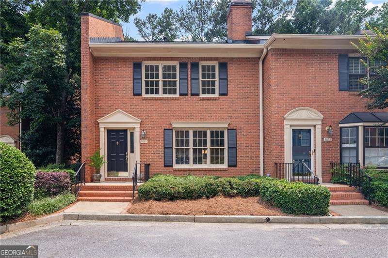 Rare Opportunity in the Heart of Vinings! Don't miss this beautifully updated townhome just steps from charming Vinings Village! Nestled in the sought-after Vinings Ridge community, this move-in-ready gem combines stylish upgrades with timeless appeal. Step inside to discover brand-new luxury vinyl plank flooring, fresh paint throughout, and elegant granite countertops accented by a chic backsplash. The neutral color palette provides the perfect canvas for your personal style. The inviting living room features a cozy fireplace, custom built-in shelving, and a large picture window that floods the space with natural light. Entertain with ease in the spacious dining room, complete with updated lighting, classic chair rail molding, and French doors that open to a private deck with tranquil, tree-lined views. The sunlit kitchen is a chef's delight, boasting stainless steel appliances, stone counters, crisp white cabinetry, and a breakfast nook with serene views and deck access - ideal for morning coffee or evening wine. Upstairs, the generous owner's suite is a peaceful retreat, featuring a wall of windows with lush views, a custom walk-in closet, and a beautifully renovated ensuite bath. The second bedroom offers surprising space and privacy with its own full bath - perfect for guests or a home office. Additional highlights include a rear-entry garage and ample guest parking. With homes in this coveted community rarely available, now is your chance to experience the best of Vinings living. Schedule your tour today - this one won't last!