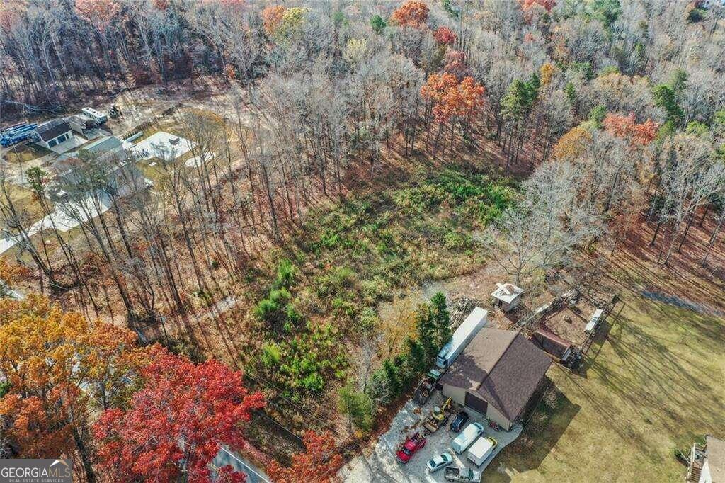 Welcome to 3048 Thompson Mill Rd, beautiful estate with 3.609 acres. This spacious property has the perfect location, a few minutes away from Shopping, Restaurants and Highly Rated Schools. All utilities are connected. Great opportunity to build your dream home or multiple homes for investment. Lot is leveled with 250 feet of frontage. Survey available. Do not miss remarkable opportunity to secure this lot!!!