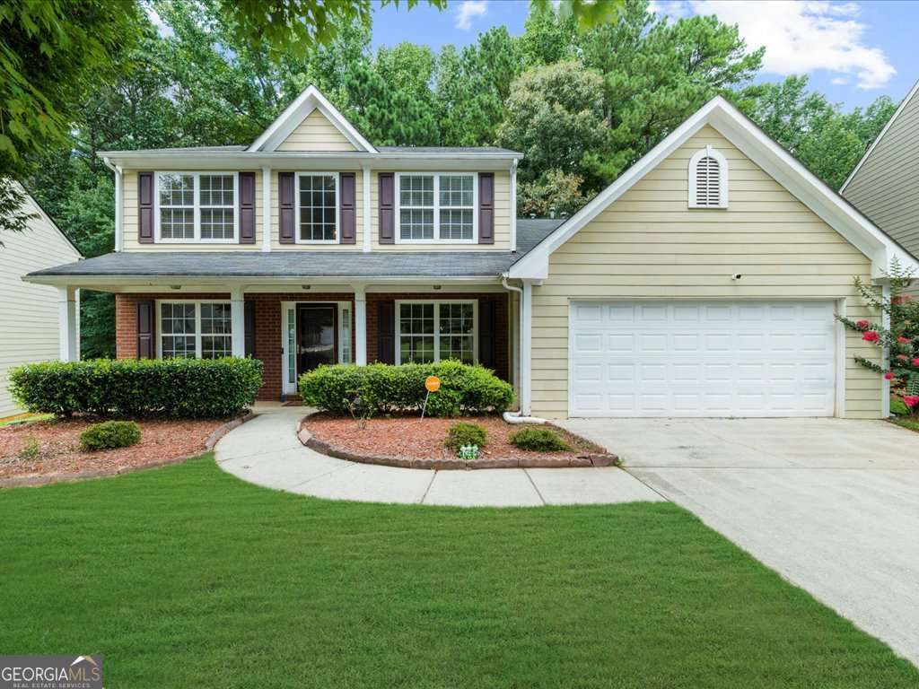 Welcome to your dream home in sought-after Ashwood Grove! This beautifully maintained 4-bedroom, 2.5-bathroom residence offers spacious living in a desirable Swim/Tennis community within the top-rated Brookwood School District. Step into the elegant 2-story foyer that flows into a grand 2-story family room with a cozy fireplace-perfect for gatherings and entertaining. The expansive kitchen features abundant cabinetry, generous counter space, and a bright breakfast area that overlooks the family room. Enjoy formal occasions in the separate living and dining rooms, ideal for hosting guests. The main-level owner's suite is a true retreat, complete with a separate sitting area, luxurious ensuite bath with garden tub, double vanity, and an oversized walk-in closet. Additional highlights include 9' smooth ceilings on the main, vaulted and tray ceilings, laminate flooring in the family room and master bedroom, and a convenient main-floor laundry. Upstairs, you'll find three generously sized bedrooms and a full bath-plenty of room for family, guests, or home office setups. The large garage includes a dedicated workshop area, offering extra functionality and storage. Don't miss your chance to own this exceptional home in one of the area's most desirable neighborhoods-schedule your private showing today!