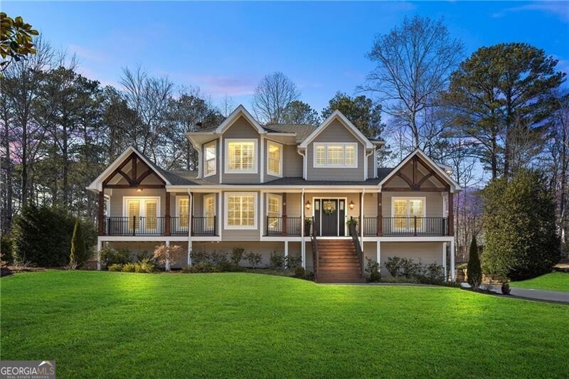 Welcome to 3051 Maple Ln., where timeless elegance meets modern luxury in the heart of Alpharetta. This extraordinary home has been meticulously redesigned and rebuilt from the ground up, with a complete renovation finished in 2022. Situated on nearly half an acre and walking distance to downtown Alpharetta, this residence offers the perfect combination of sophistication, comfort, and convenience. As you step inside, you're greeted by a stunning open floor plan with engineered hardwood floors throughout, custom cabinetry, and exquisite finishes at every turn. The heart of the home is the chef's kitchen, featuring Jenn Air appliances, a built-in refrigerator, a custom butler pantry, and sleek countertops, making it ideal for entertaining and everyday living. The home boasts 4 spacious bedrooms and 5.5 luxurious bathrooms, including a main-level primary suite that feels like a private retreat. With direct access to the wraparound patio and backyard, this suite offers a custom spa-like bathroom and a designer walk-in closet. Upstairs, you'll find the original master suite with a fully remodeled en-suite, a secondary bedroom, and a loft space perfect for relaxing or working from home. The finished basement is equally impressive, currently designed as a wellness space with 3 separate rooms, a kitchenette, a second laundry room, and a large sitting area. A curved wall leads to a private outdoor entrance, offering endless possibilities for use. Step outside into your personal oasis, complete with a saltwater pool, custom fire pit seating, turf lawn, and iron fencing. The fully fenced backyard also features a dedicated turf area for pets, along with professional landscaping and outdoor lighting that create a serene and inviting atmosphere. Additional features include a 3-car garage, gas lanterns on the front porch, plantation shutters throughout, a tankless water heater, foam insulation, a $5K water filtration system, a state-of-the-art security system, and much more. This home is truly one of a kind, offering luxury living with no HOA and an unbeatable location just steps from all that downtown Alpharetta has to offer. Don't miss the opportunity to call 3051 Maple Ln. your forever home. Schedule your private tour today and experience the epitome of modern luxury!