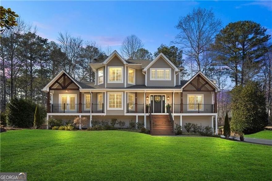 Welcome to 3051 Maple Ln., where timeless elegance meets modern luxury in the heart of Alpharetta.  This extraordinary home has been meticulously redesigned and rebuilt from the ground up, with a complete renovation finished in 2022. Situated on nearly half an acre and walking distance to downtown Alpharetta, this residence offers the perfect combination of sophistication, comfort, and convenience.  As you step inside, you're greeted by a stunning open floor plan with engineered hardwood floors throughout, custom cabinetry, and exquisite finishes at every turn. The heart of the home is the chef's kitchen, featuring Jenn Air appliances, a built-in refrigerator, a custom butler pantry, and sleek countertops, making it ideal for entertaining and everyday living.  The home boasts 4 spacious bedrooms and 5.5 luxurious bathrooms, including a main-level primary suite that feels like a private retreat. With direct access to the wraparound patio and backyard, this suite offers a custom spa-like bathroom and a designer walk-in closet. Upstairs, you'll find the original master suite with a fully remodeled en-suite, a secondary bedroom, and a loft space perfect for relaxing or working from home.  The finished basement is equally impressive, currently designed as a wellness space with 3 separate rooms, a kitchenette, a second laundry room, and a large sitting area. A curved wall leads to a private outdoor entrance, offering endless possibilities for use.  Step outside into your personal oasis, complete with a saltwater pool, custom fire pit seating, turf lawn, and iron fencing. The fully fenced backyard also features a dedicated turf area for pets, along with professional landscaping and outdoor lighting that create a serene and inviting atmosphere.  Additional features include a 3-car garage, gas lanterns on the front porch, plantation shutters throughout, a tankless water heater, foam insulation, a $5K water filtration system, a state-of-the-art security system, and much more.  This home is truly one of a kind, offering luxury living with no HOA and an unbeatable location just steps from all that downtown Alpharetta has to offer.  Don't miss the opportunity to call 3051 Maple Ln. your forever home. Schedule your private tour today and experience the epitome of modern luxury!