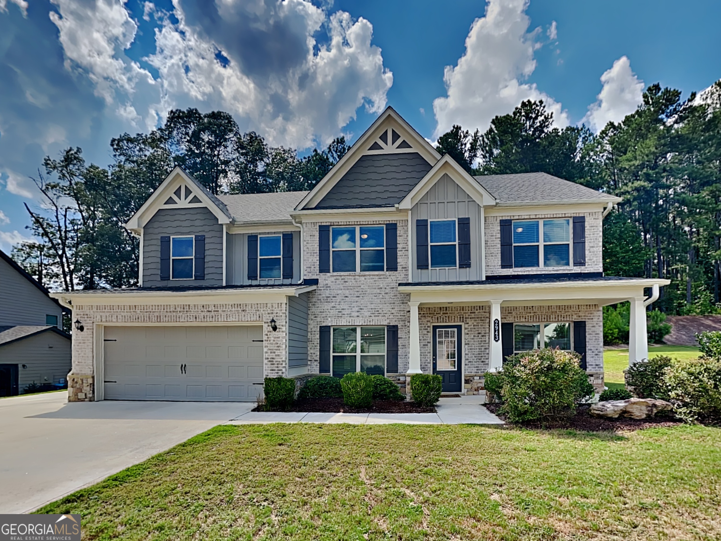 Welcome to 2943 Bluestone Court, a spacious 5 bedroom, 3 bathroom home located in a quiet Dacula subdivision. Step into gleaming hardwood floors and elegant details, including chair railing in the formal dining room and a private office on the main level. The main floor guest bedroom features its own entrance to a full bathroom ideal for guests or multi-generational living. The family room has a stunning coffered ceiling and a tile surround fireplace, perfect for cozy evenings. The eat in kitchen is a chef dream with a large island, granite countertops, stainless steel appliances, and a tile backsplash for added style. Upstairs, the spacious primary suite offers a tray ceiling, walk in closet, and a spa like bath complete with tile floors, a whirlpool tub, and a separate shower. A versatile loft area adds even more living space, perfect for a playroom or media center. Enjoy the outdoors from the covered back porch with ceiling fan, and take advantage of ample parking and storage with the 3- car garage. This home blend space, comfort, and style all in a prime location. Schedule a showing today.