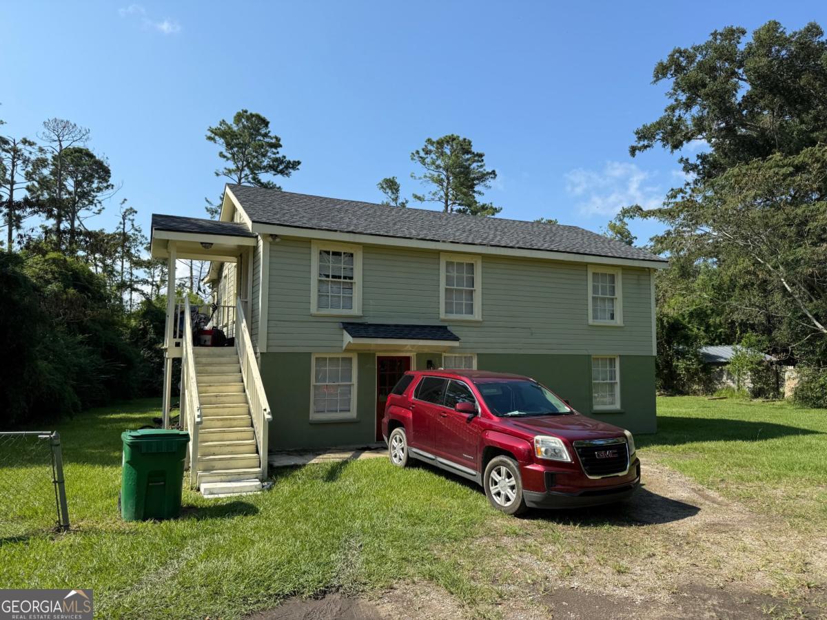 This great investment property is renovated and now available! The dwelling sits back off of the road on the 1/2 acre lot for improved privacy. Both units of this duplex features 2 bedroom, 1 bath in 880 sq ft with an upstairs/downstairs configuration. The roof was recently replaced, along with flooring, paint, and fixture upgrades. Tankless water heaters in each unit, and newer mini split downstairs. Each unit rents for $850 a month, downstairs Unit A was left vacant for the sale. Call your favorite REALTOR for a showing!