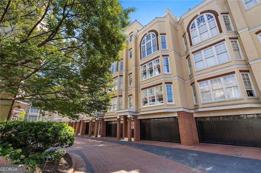 Experience upscale living in the heart of Buckhead with this beautifully remodeled townhouse in an exclusive gated community. Recently updated with a brand-new roof, a new HVAC system, and a fully renovated kitchen, this home offers modern upgrades in one of Atlanta's most desirable locations, with its very own elevator. As you enter, you'll find hardwood floors throughout and a spacious guest bedroom with an en suite bathroom on the first level. A dedicated flex room on this level is perfect for a home office, gym, or media space, and the laundry closet is conveniently located nearby. The next level is home to a luxurious primary suite filled with natural light from large windows. The spa-like bathroom features a jacuzzi tub, separate shower, double vanity, and a custom California Closet system. Upstairs, the recently remodeled kitchen with quartz countertops flows seamlessly into a dedicated dining area and an expansive living room with cathedral ceilings, a bay window front, and a cozy gas fireplace. From here, step out to the private rooftop terrace and enjoy breathtaking views of the Buckhead skyline - the perfect spot for entertaining guests or relaxing at the end of the day. All levels are conveniently accessible via elevator. Situated just minutes from Chastain Park and the Shops of Buckhead, with easy access to the area's best dining, shopping and entertainment the city has to offer. This home combines modern comforts with an unbeatable location.