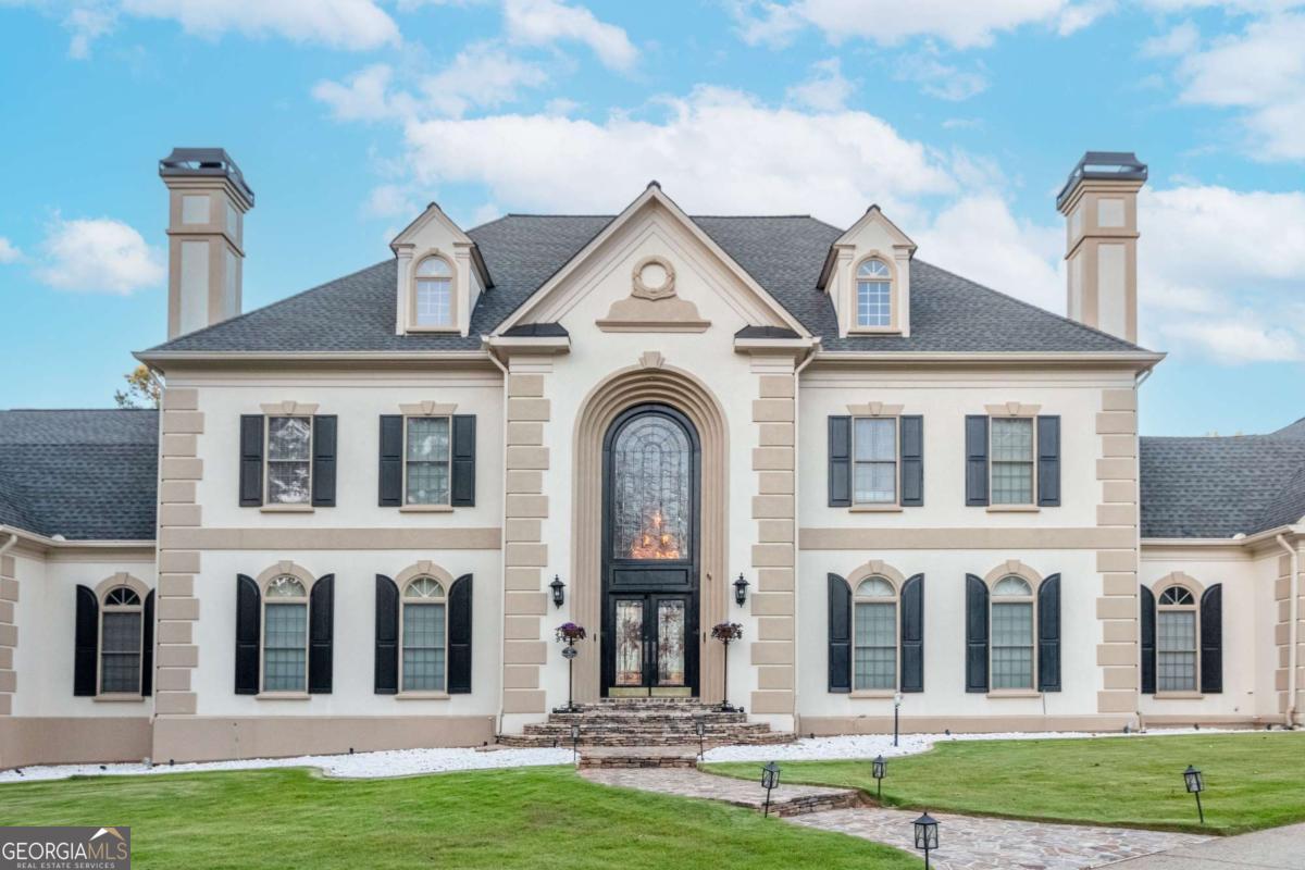*Major Price Reduction* Take Advantage of Market Conditions! This is a rare opportunity to secure instant equity in one of Marietta's premier estates. The home has been freshly cleaned out and is ready for your vision. Act fast, schedule your private showing today and bring your best offer before it's gone! Come experience luxury living in this meticulously maintained Marietta estate in the prestigious Wynthrop Manor community! Nestled on 3.95 private acres, this 13,411 sq. ft. home boasts 7 bedrooms, 6 full baths, and 2 half baths across 3 finished levels. Thoughtfully designed with an elevator, a 6-car garage, and dual laundry rooms on the main and second level, this home offers unparalleled convenience. The main level features 2 bedrooms, 2 full baths, and 1 half bath, along with an extravagant office, elegant dining room, and custom large closets. The second level includes 3 spacious bedrooms and 3 full baths, while the finished basement offers 2 bedrooms, 1 full bath, and 1 half bath, plus a game room, gym, interior koi pond, and hot tub. Outdoors, enjoy the in-ground pool, putting green, and beautifully landscaped yard with a forestry feel. Walking distance to Kennesaw Mountain Park and close to top-rated schools, shopping, and dining. This estate is an absolute must-see!