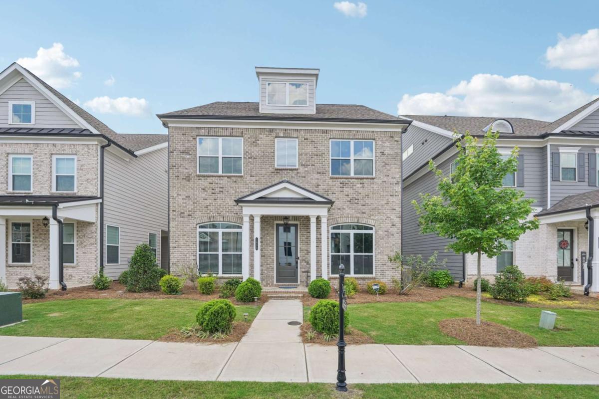 NORTH FACING - Stunning 3-Story Home in Gated Central Park at Deerfield | Top Forsyth Schools This beautifully maintained home features hardwood floors, soaring 10' ceilings, and a chef's kitchen with stacked white cabinets, stone countertops, and stainless steel appliances. The main level includes a guest room with full bath, a separate powder room, a spacious great room, and a private patio perfect for entertaining. Upstairs offers a luxurious owner's suite with dual walk-in closets, plus three additional bedrooms and a full laundry room. The third floor adds flexibility with a large bonus room, additional bed and bath, and unfinished attic space. Ideally located near Avalon, Halcyon, and Downtown Alpharetta. Enjoy resort-style amenities including pool, tennis, walking trails, and gated security-all in an award-winning Forsyth County school district.