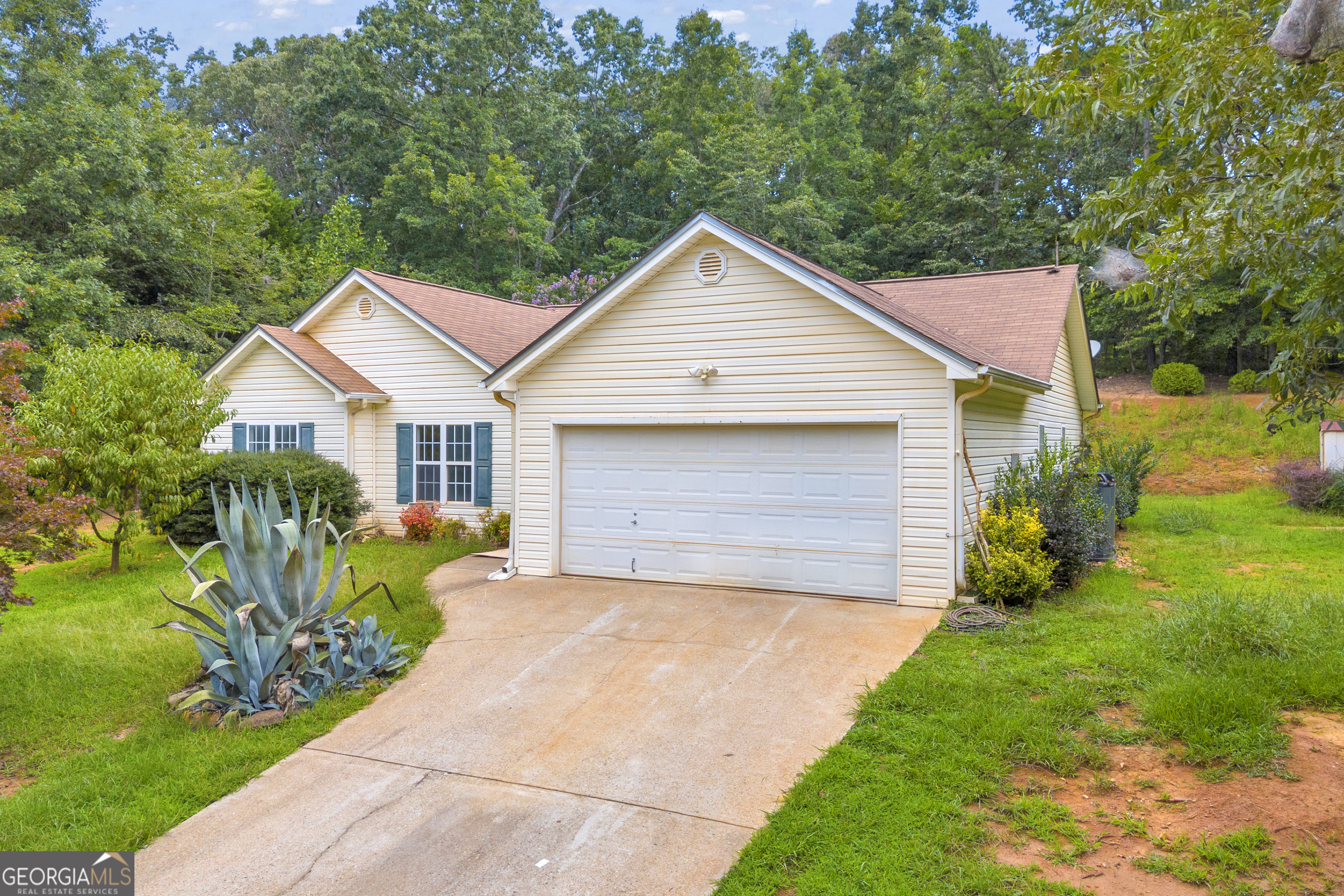 Tucked away among mature trees, this charming 3-bedroom, 2-bath home offers the perfect balance of privacy and convenience. With 1,442 sq ft of comfortable living space, a long private driveway, and fresh updates including new flooring and paint throughout, you'll feel like you've found your own retreat while still enjoying the benefits of a welcoming neighborhood. Step inside to a bright, open layout designed for easy living. The cozy living room is ideal for family nights or quiet evenings, while the spacious kitchen makes cooking and entertaining a breeze. Outside, the tree-lined backyard gives you plenty of room to relax, play, or host gatherings-all with the added bonus of natural privacy. Located just minutes from schools, local shopping, and easy highway access, this home combines peace and comfort with everyday convenience. Seller will provide lawn care/maintenance prior to closing.