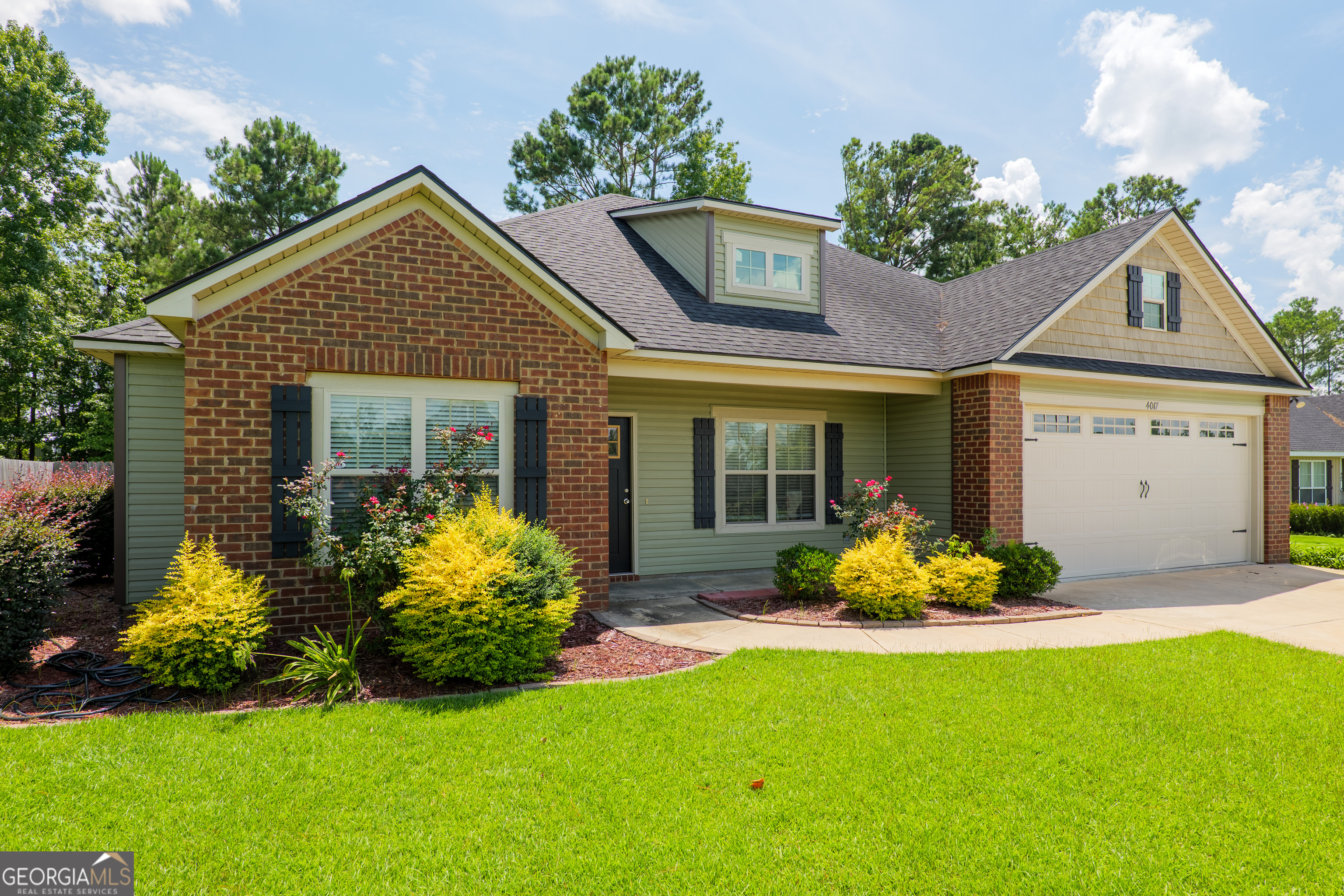 Welcome home to the highly sought-after Gramercy Subdivision, where you'll enjoy the convenience of a beautiful neighborhood with no HOA restrictions! This meticulously maintained 4-bedroom, 2-bathroom home offers a perfect blend of comfort, style, and functionality - making it ideal for families, first-time buyers, or anyone looking for space to spread out. As you step through the front door, you're welcomed into a bright and open-concept layout that immediately feels inviting. The spacious living room flows seamlessly into the dining area and chef's kitchen, making it perfect for entertaining or enjoying quality time at home. The kitchen is truly the heart of the home, featuring a massive island with granite countertops, an abundance of cabinet space, stainless steel appliances, and plenty of room for barstools or casual dining. Whether you're preparing meals or hosting gatherings, this space is as functional as it is beautiful. The primary suite is a true retreat, complete with a charming coffered ceiling that adds architectural interest and elegance. The attached spa-inspired en-suite bathroom offers everything you could want - a soaking tub, a tiled walk-in shower with dual shower heads, double vanities with granite counters, and not one, but two spacious walk-in closets for ultimate organization and convenience. The additional three bedrooms are all generously sized and share a well-appointed full bathroom, also featuring granite countertops and modern finishes. Step outside to your fully fenced and landscaped backyard, where you'll find a covered back porch-the perfect spot to enjoy your morning coffee, unwind in the evenings, or host weekend barbecues. The yard is just the right size for pets, kids, or gardening, while remaining low-maintenance. Located just minutes from shopping, dining, schools, and Moody Air Force Base, this home checks all the boxes and more.