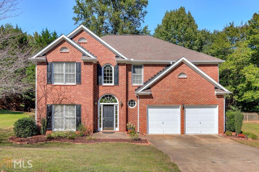 Welcome to bright and spacious living! Enter into the open 2-story foyer. Lounge in the formal living room with glass french doors. Entertain guests in your formal dining room with tray ceiling, exquisite trim work, and butler's pantry that leads to the laundry room. All white kitchen and family room with open concept living in mind. New dishwasher added in Fall 2020. Stainless steel appliances, island, pantry, and plenty of counter space for even the most demanding hosting needs.  2-story family room, illuminated by gorgeous chandelier and towering windows with a view to the backyard, cozy up by the fireplace in the colder months. This home comes complete with gleaming hardwoods throughout the entire home! Venture upstairs to the spacious owner’s suite with tray ceiling. Relax or get ready for your day in the en-suite bath with double vanity, soaking tub, separate shower, and walk-in closet. There are 3 additional bedrooms upstairs and a shared bath. Outside venture into the fenced-in private level backyard and relax on the covered brick patio. New roof added in July 2020. Interior recently painted in the entryway, hallways, family room, kitchen, butler's pantry, and stairs. Make your appointment today to see why you should call this home!
