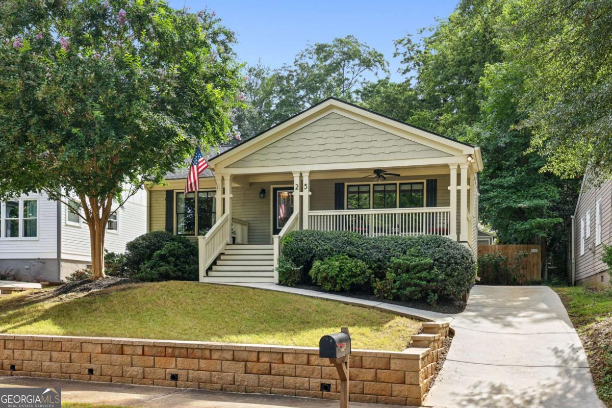 This charming home is a perfect blend of classic style and modern convenience. The open-concept main living area, where the kitchen and living room seamlessly connect, makes it an ideal spot for entertaining or relaxing with friends and family. The kitchen is a chef's delight, featuring rich wood cabinetry, granite countertops, and stainless steel appliances. An oversized island with seating offers a perfect casual dining spot, while the adjacent dining area provides a more formal setting for meals and gatherings. Tucked away for privacy, the primary bedroom is a spacious sanctuary with a serene, neutral palette. The large primary bath offers a double vanity, private water closet, and a walk-in shower with dual shower heads and a built-in bench. The second bathroom, equally well-appointed, is conveniently located between the two secondary bedrooms. Smart, functional spaces enhance daily living, including a well-designed mudroom bench just off the kitchen-perfect for organizing coats and shoes-and a dedicated laundry closet. Outside, you'll find plenty of room for outdoor living. Enjoy your morning coffee on the front porch or entertain guests on the covered side patio/deck, which provides a private space for outdoor dining and relaxing. The expansive backyard is a wonderful area for activities, complete with a storage shed for all your tools and toys. This home offers significant upgrades for peace of mind, including a new sewer line (2024), new roof (2019), new HVAC system (2015), and French drains & a sump pump (2015). Located in the heart of Edgewood, this home is convenient to dining, shopping, and commuting.