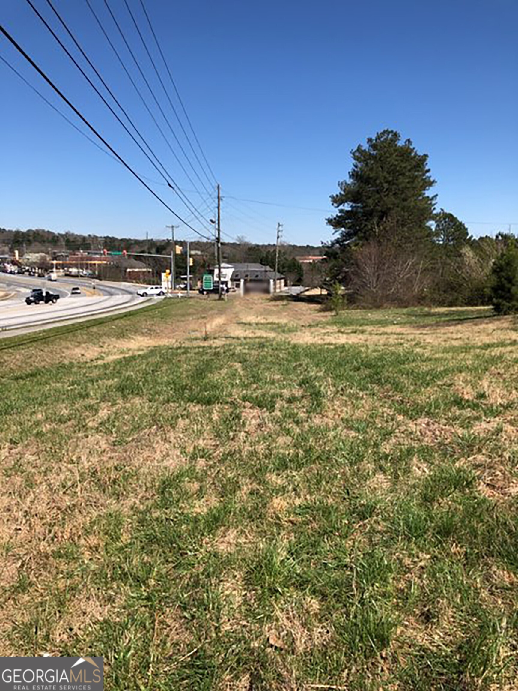 The potential and possibilities of this property are ENDLESS!! Conveniently located and a prime location for development. Area of rapid growth and with high traffic counts. The house and out building are considered "tear down" in terms of use.