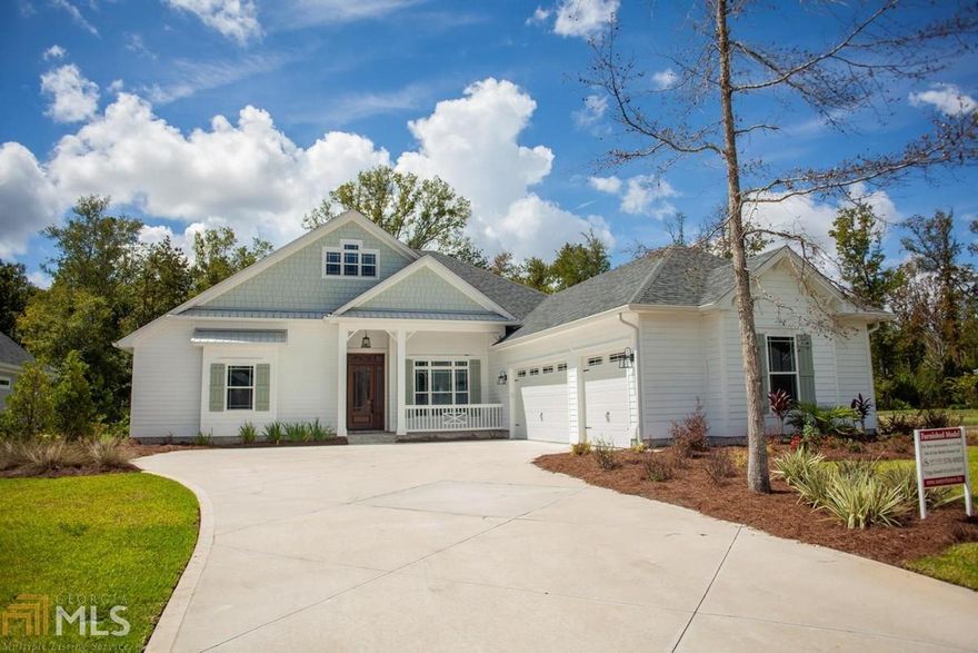 New Construction. Step into the this coastal cottage style home with great views of the protected wetlands behind the home as well as the privacy these wetlands afford. This home features two living areas and a dining room. All living areas are tile with crown molding. The large kitchen has stainless steel appliances, quartz counter tops, walk-in pantry and custom wood cabinets. The over-sized master suite features a separate tile shower, large soaking tub, huge walk-in closet, and dual vanities. The three car garage is finished in T1-11 wood paneling on the walls. The large outdoor living space offers great place to relax or entertain guests. The HOA includes lawn care, irrigation, and access to the pool and fitness center.