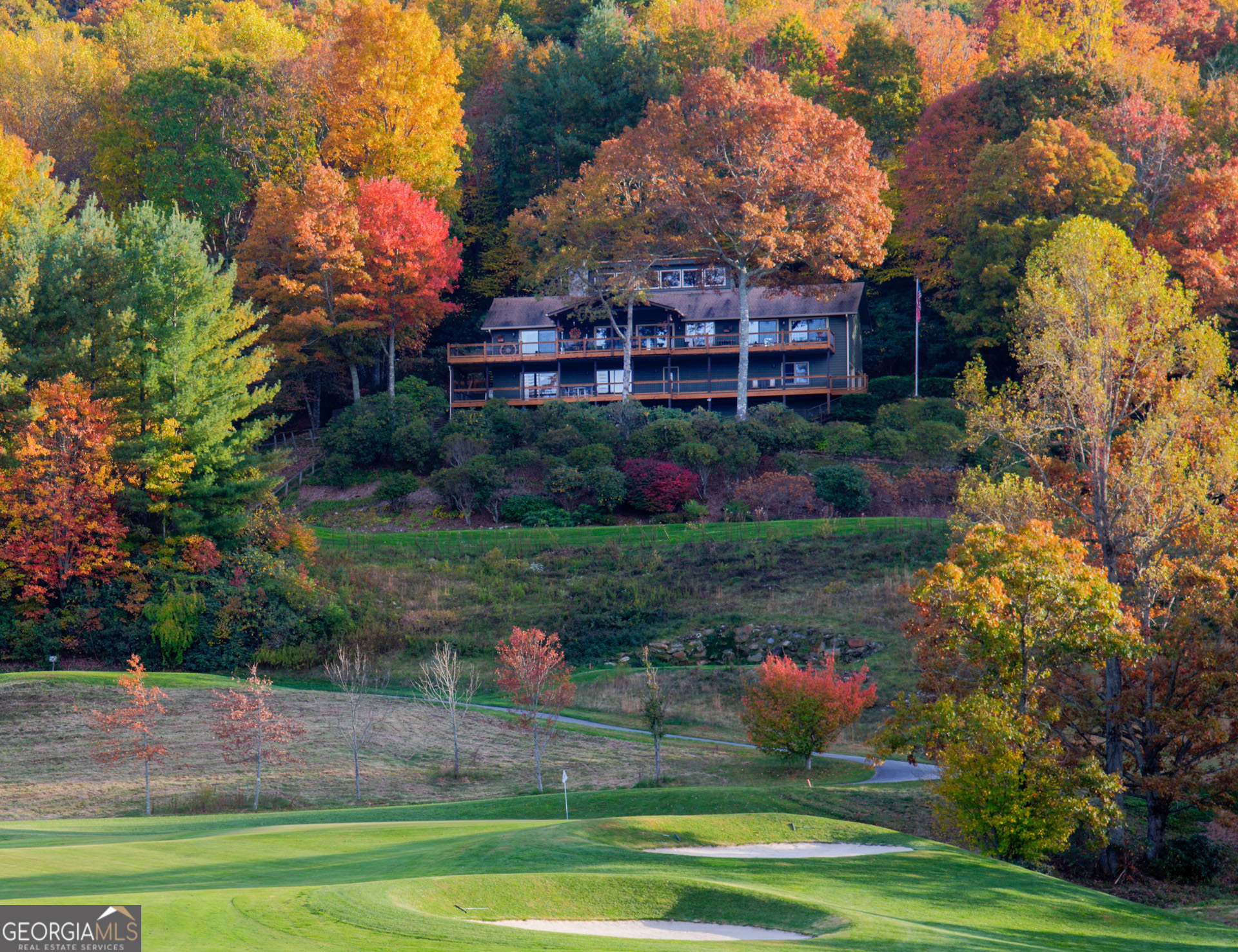 Welcome to an exceptional living experience, a home where the North Carolina mountain views meet the fairway. This unique 4-bedroom home sits on one of the most coveted lots in Sky Valley, with direct frontage on the 12th tee box. From your deck enjoy vistas stretching across holes 12, 16, and 11. The unique design maximizes the immersive experience with glass walls in every room. The open concept floor plan flows effortlessly onto the deck to take in the sweeping views and front-row for the fireworks display on July 4th . A MUST-SEE HOME!