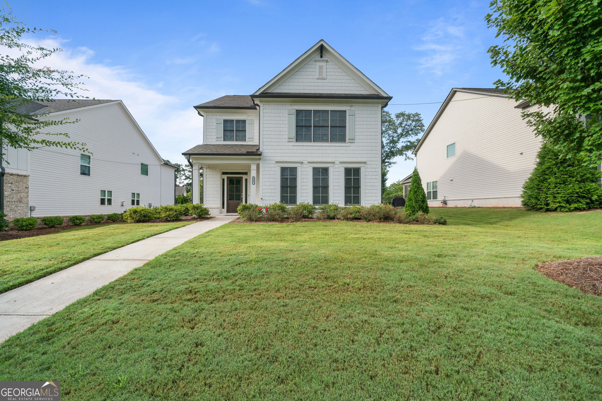 Welcome to this neat and tidy Briarwood plan home in the desired Avondale East community. Quickly you'll appreciate the beautiful entrance appeal and outdoor charm with a tastefully landscaped lawn, driveway, and a privately fenced yard. Make your way through the front door into an over-sized open concept family room with a cozy decorative fireplace paired with custom built-ins. Lots of natural daylight enhances the sense of spaciousness with the gorgeous kitchen perfect for both relaxation and entertaining. The elegant kitchen has generous cabinet storage, quartz counters, walk-in pantry, large island with counter for stools, stainless appliances, and a kitchen dining area. Completing the main level is hand-stained solid hardwood stair treads, hand scraped engineered floors, closets, powder room, mudroom, 2-car roomy garage, and back door to the covered patio. Stunning wood stairs take you to the upper level with hardwood on the landing and hallway, 2 spacious secondary bedrooms with vaulted ceilings connected to a jack-and-jill private bathroom, and a generous laundry room. The upper floor owner's suite is extra-large perfect for family, study, or other personal uses, well suited with 2 walk-in closets, tray ceiling, and a bathroom with a glass and tiled shower, huge soaking tub, private water closet, and double vanity. This beautiful home is adjacent to the Stone Mountain Trail and a short distance from downtown Avondale with new green space, restaurants, and breweries. Perfectly located less than a mile from the charm and energy of the historic downtown Avondale Estates with restaurants, retail, breweries, community events and the new Town Green. You're just minutes from the DeKalb Farmers Market, multiple parks, the PATH and top-rated schools, with a short commute to Downtown Decatur, Emory, CDC and major highways. Schedule your tour today and come see this amazing home!!