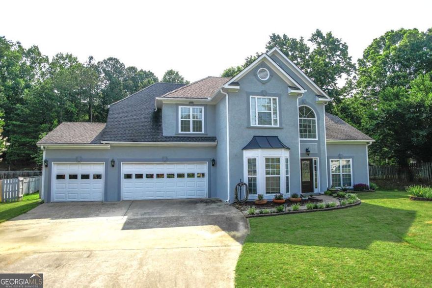 Charming Move-In Ready 4-Bedroom Home in Sought-After Four Seasons on Lanier!  Don't miss this opportunity to own a beautifully maintained 4-bedroom home in the heart of Flowery Branch, just minutes from Lake Lanier. Located in the desirable Four Seasons on Lanier community, this home offers comfortable living and a vibrant neighborhood atmosphere.  Step into the inviting two-story foyer with hardwood flooring and tile throughout the main living areas. The main level features a formal dining room and a versatile living room-perfect for a home office, playroom, or flex space. The cozy family room boasts abundant natural light and a charming fireplace, seamlessly connecting to the open-concept kitchen and breakfast area.  The kitchen is a cook's delight with stainless steel appliances, stained wood cabinets, a breakfast bar, and a sunny breakfast nook that offers peaceful views of morning sunrises and visiting birds and wildlife.  Upstairs, the spacious primary suite features room for sizable furniture, a double vanity, a garden tub, and two generous walk-in closets. Three additional bedrooms provide plenty of space for family, guests, or hobbies.  Garage provides three parking spaces or room for recreational vehicles, front and back yard are level with fenced in grassy back yard.  Community highlights include:  * 75-foot swimming pool  * Lakefront clubhouse with swim dock  * Walking trails and scenic picnic pavilion  * Modern playground, tennis/pickleball courts, volleyball court, and baseball field  * Enclosed dog park  * Stocked fishing pond and private lake access for canoeing/kayaking  Conveniently located just 2 miles from Van Pugh boat ramp and the University Yacht Club, and close to downtown Flowery Branch offering Farmer's Market, live music events, shopping, dining,  and top-rated schools.  This home has it all-location, space, and lifestyle-and is priced to sell. Schedule your private showing today and experience the best of lake area living in one of Flowery Branch's most sought-after communities!