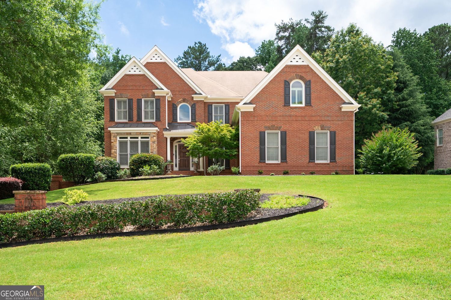 Welcome to Stonebridge at Mud Creek - Where Luxury Meets Location! Nestled in one of the most exclusive and highly sought-after neighborhoods, this beautifully updated home captures the essence of refined living and exudes elegance, comfort and sophistication. Renowned for its top-rated Hillgrove High School district and just minutes from premier shopping, dining, the Historic Marietta Square, Kennesaw Mountain and more, Stonebridge at Mud Creek is known for its prestige, oversized lots and community charm. Upon entering this remarkable residence, you are greeted by an expansive 2-story foyer that seamlessly transitions into a spacious living area, drenched in natural light from large windows that frame picturesque views of the outdoors. Come discover a freshly painted interior that gives the home a modern, move-in-ready feel. At the heart of the home, you'll find a stunning, updated kitchen with premium finishes, perfect for everyday living or entertaining. This kitchen is outfitted with stainless steel Gen Air appliances and classic stained 42" cabinets providing ample storage. The expansive island can accommodate up to eight (8) for seating, is equipped a vegetable sink and hidden outlet for your convenience and culinary creativity. This open concept home continues to impress with a 2-story family room featuring a cozy fireplace, custom bookcase, a spacious laundry/mud room and custom finished hardwoods throughout the main floor. The main floor also features a separate dining room and sitting/living room. The separate dining room presents an ideal venue for elegant dinners and festive celebrations, accommodating a large dining table. The sitting/living room exudes elegance and style, while enhancing the overall functionality of this inviting home. Don't miss the oversized guest bedroom with an en-suite bath and walk-in closet, ideal for visitors or multi-generational living. Retreat to the luxurious owner's suite on the 2nd level, a true sanctuary featuring a newly remodeled bathroom with dual vanities, soaking tub, walk-in shower, custom built storage, a spacious boutique-style closet and a smaller, yet spacious secondary closet. Upstairs, you'll also find 3 additional secondary bedrooms, 2 full baths, and a versatile bonus room, providing ample space for your family to feel right at home. Transitioning to the finished terrace level, beautifully designed for both relaxation and entertainment, it offers a full second kitchen, an additional guest bedroom, an entertainment room, game room and unfinished space that can easily be converted into a home office or gym. As you venture outside, the outdoor living space invites you to a harmonious setting for relaxation and leisure. Both the deck off the kitchen and patio off the game room at the terrace level provide the perfect setting for hosting barbecues or enjoying tranquil evenings, surrounded by friends and family. Whether you're looking for everyday comfort or room to host in style, this home checks every box. Don't miss your chance to own in one of the area's most desirable communities. Schedule your private tour today!