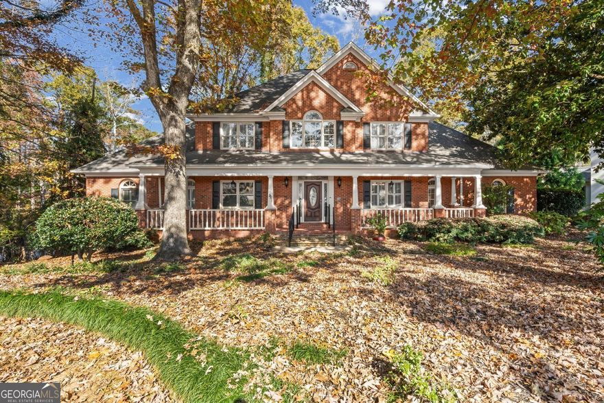 Welcome home to this custom-built residence, offering exceptional craftsmanship, thoughtful details throughout, in highly sought-after Polo Golf and Country Club. As you approach the 4 sided brick home, you'll appreciate the beautiful curb appeal on the cul-de-sac lot, new driveway & newly fenced backyard overlooking the peaceful private pond shared with neighbors. Step inside to discover beautiful real hardwood floors through out, an abundance of natural light & an inviting flow designed for both comfortable living & entertaining. The main level features the oversized primary bedroom with a en-suite bath, offering a soaking tub, separate shower, double vanities, walk in closet & convenient coffee/cocktail wet bar.  The separate formal dining room pairs perfectly with the separate formal living/den/flex room, providing multiple gathering spaces. A large family room with a masonry fireplace creates a cozy atmosphere for gatherings & relaxing, which leads to an inviting bright sunroom, with walls of casement windows & screens to open & enjoy the fresh air & views of the pond. The eat-in kitchen features recently updated appliances, kitchen island, stone countertops, an abundance of cabinets & plenty of room to expand, if wanted, into the breakfast room with pond views as well.  As you head upstairs, you'll find generously sized bedrooms, including a junior suite with a private en-suite & 2  additional bedrooms with a shared bath & double vanities. Additional walk-in attic areas provide rare abundant storage.  As you head to the fully finished terrace level, you'll be pleased, as it offers incredible flexibility for entertaining or multigenerational, au pair or in-law suite possibilities, complete with a well appointed 2nd full eat in kitchen with new appliances, an additional bedroom & full bath, a large family/flex gathering room with a 2nd masonry fireplace to enjoy, an office, storage & an additional three-season porch with sliding vinyl panels overlooking the beautiful fenced backyard & pond, to add year-round enjoyment & a beautiful indoor-outdoor flow. The home boasts extensive updates including: A newer 30 year architectural roof, 2 HVAC systems (upstairs replaced 5 years ago), new water heater (3 years ago), new driveway, new black iron fence & updated appliances in both kitchen. Residents enjoy premier amenities including: Full-service country club with restaurant, 18-hole championship golf course & driving range, family pool with slide & adults-only pool, 8 hard courts, 2 clay-lighted tennis courts, pickleball courts, tennis pros offering group & private lessons, swim team, basketball, full calendar of social events, optional social/tennis/pool/golf memberships, direct access to the Big Creek Greenway & just a short golf cart ride to Vickery Village for shopping, an award winning brewery, gyms & multiple restaurants. It's just a quick drive to an abundance of shopping & restaurants at Halcyon, The Avalon, The Collection at Forsyth, as well as Trader Joe's & Whole Foods (opening soon). Convenient to Northside Forsyth Hospital, top ranked Forsyth County Schools & easy access to Hartsfield-Jackson International Airport via GA-400. Schedule your private showing!