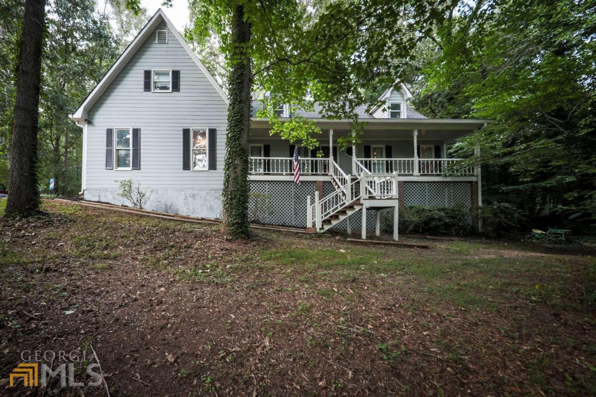 Refinished home on 1+ acre! NEW flooring, 2 NEW HVAC Units, NEW hot water heater, NEW back deck, NEW front stairs, NEW oven, remodeled kitchen, exterior freshly painted, interior freshly painted, Roof is only 6 years old! Huge front porch! Peaceful neighborhood, but less than 2 miles from grocery and restaurants. Bonus room upstairs could be a 5th bedroom.