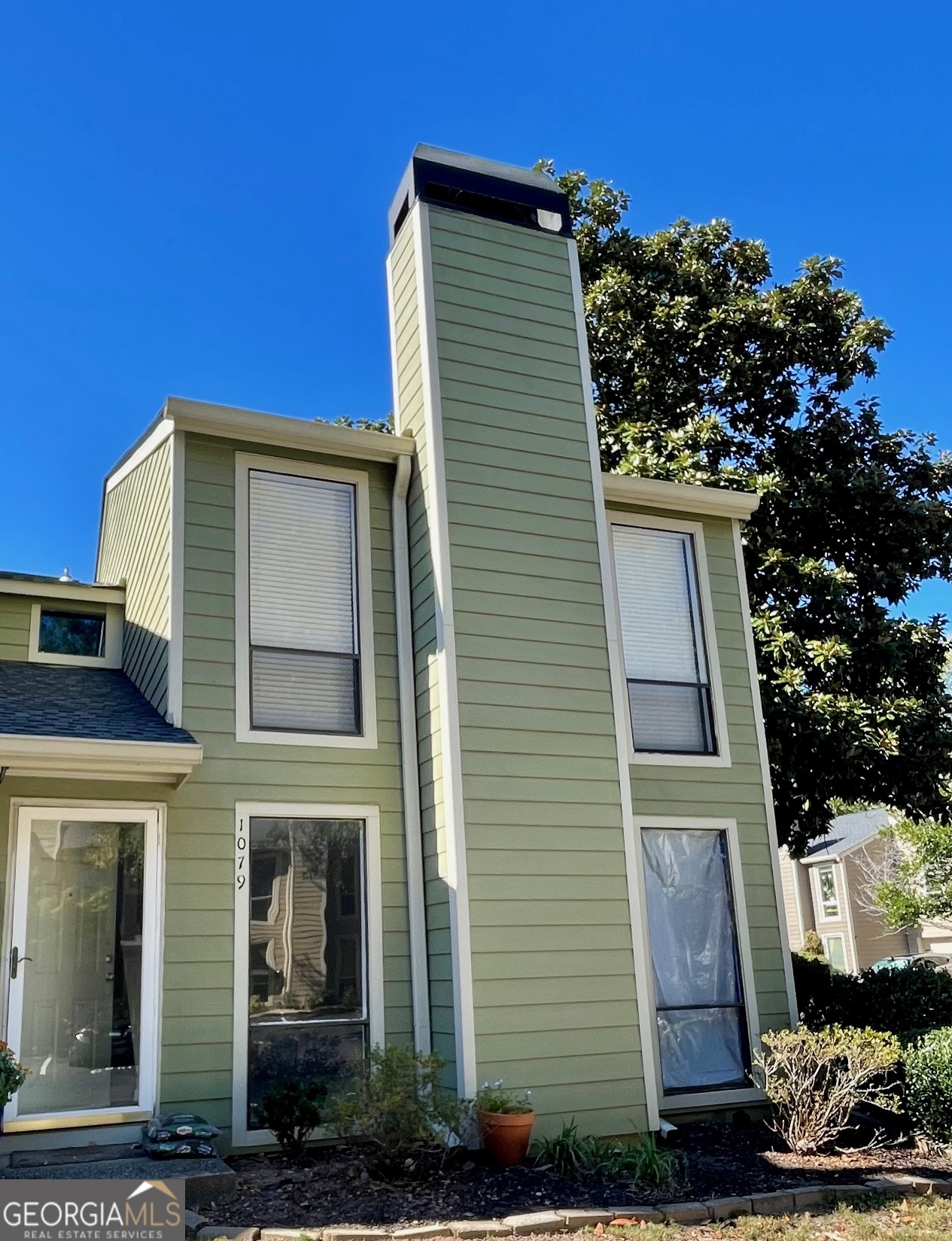 INVESTOR SPECIAL - SOLD "AS IS" WITH RIGHT TO INSPECT. No Disclosure due to the current owner not ever living in the unit. End Unit Townhome in a Gated Community Fantastic opportunity for investors or buyers ready to customize their dream home! This end-unit townhome offers abundant natural light, added privacy with only one shared wall, and a premier location near the Chattahoochee River. A recent pipe leak near the hot water heater caused flooding on the first floor. The remediation team has already completed the hard work - drywall removed several feet up, flooring taken out, and damaged materials professionally removed, including the half bath fixtures, lower kitchen cabinets, and all appliances. The home is now a clean slate, ready for your personal design and finishing touches. You can start fresh or consider reinstalling the existing cabinets and appliances that remain on site. New flooring will be needed throughout the first level, and the upstairs carpet is due for replacement. Upstairs, the primary suite features two closets and a private bath with space to easily convert the single vanity into a double. The secondary bedroom includes a walk-in closet and private bath. The HOA is at rental capacity and a 3 year wait for leasing. Enjoy the landscaped yard and relax as you watch the Chattahoochee River flow by. Walk to Ray's on the River for dinner or take advantage of easy access to I-75, I-285, The Battery/Braves Stadium, Chattahoochee River Nature Preserve, Ackers Mill retail and dining, Cumberland Mall, and Costco. This is a prime location and a perfect project property - the hard part is done; now it's ready for your vision!
