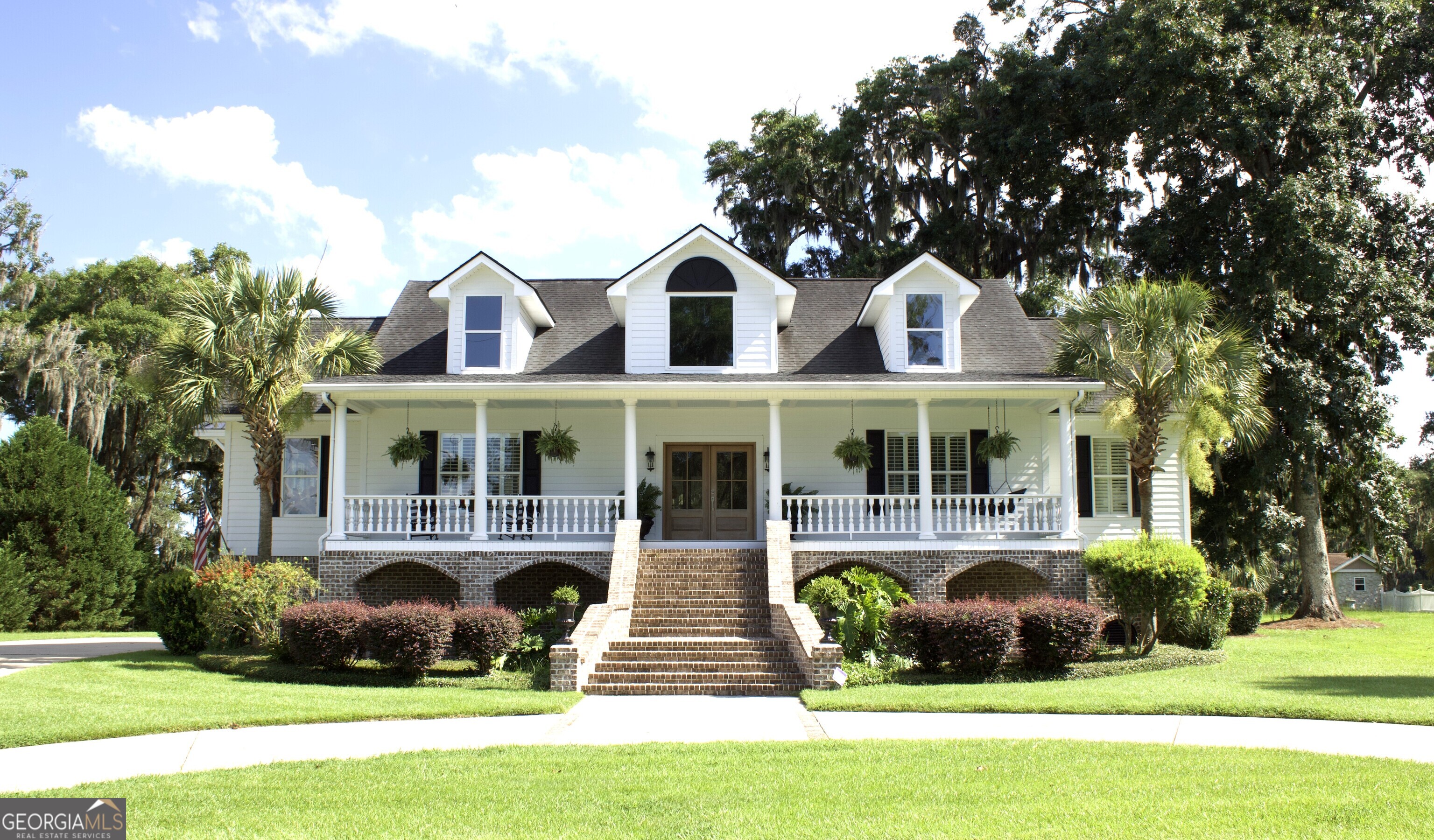 Your dream home could be a Southern Colonial style nestled between cascading oaks trees, rare lot with serene marsh views in the backyard and deep water frontage in the front, offering truly unique coastal lifestyle. This home offers timeless elegance and modern comforts. From walking up the grand stairs to the inviting front porch sets the tone for what's inside: spacious, light-filled interiors featuring hardwood floors, detailed crown molding, and refined finishes throughout. The heart of the home is a chef's dream-an updated kitchen with luxurious marble countertops, high-end appliances, and a generous layout perfect for entertaining. Enjoy a peaceful breakfast nook where you can enjoy stunning sunrise views over the water. The primary suite offers a quiet retreat with a spa inspired en-suite bath and generous walk-in closet. Entertain with ease in the formal living room, or gather comfortably in the spacious family room-perfect for relaxing evenings or hosting friends and loved ones. When it is time to unwind, step out onto the back porch and take in the calming marsh views, coastal breezes, and sounds of nature. The seller is a licensed realtor in GA.