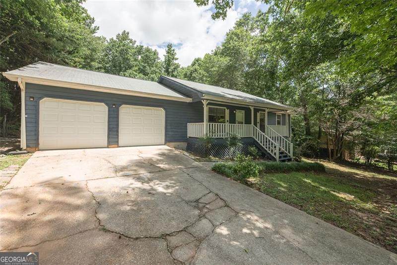Discover comfort, space, and functionality in this well-appointed 3-bedroom, 2-bathroom residence nestled in the peaceful community of Stockbridge, located in Henry County. This home is packed with value from the moment you arrive, starting with the large, private backyard, ideal for outdoor gatherings or quiet evenings under the stars. A covered deck provides a cozy spot to relax, rain or shine, while the welcoming front porch adds a touch of Southern charm. Youll also enjoy the convenience of a 2-car garage and a dedicated laundry room with washer/dryer connections. Enter into a light-filled, open floor plan designed for easy living and entertaining. Plush carpeting runs throughout the home, and ceiling fans are installed in each room for added comfort. The spacious bedrooms offer generous closet space and flexibility to suit your lifestyle, whether you need a home office, a guest room, or a personal retreat. The kitchen is a standout, featuring warm, oak-wood finished cabinets, a center island perfect for meal preparation, a gas stove, dishwasher, and ample storage. Adjacent to the kitchen, a separate dining room provides the ideal setting for sit-down dinners or holiday celebrations. Both bathrooms are designed with comfort in mind. The guest bath includes a shower/tub combo, while the primary bathroom boasts a luxurious garden spa tub, creating the perfect space to unwind after a long day. Located just minutes from I-75, this home offers the perfect balance of suburban tranquility and easy access to everyday conveniences. All Sovereign Realty & Management residents are enrolled in the Resident Benefits Package (RBP) for $35.00 per month, which includes liability insurance, credit building to help boost residents' credit scores with timely rent payments, our best-in-class resident rewards program, on-demand pest control, and more. More details upon application. Dont miss the opportunity to lease this inviting and spacious home in a sought-after neighborhood.