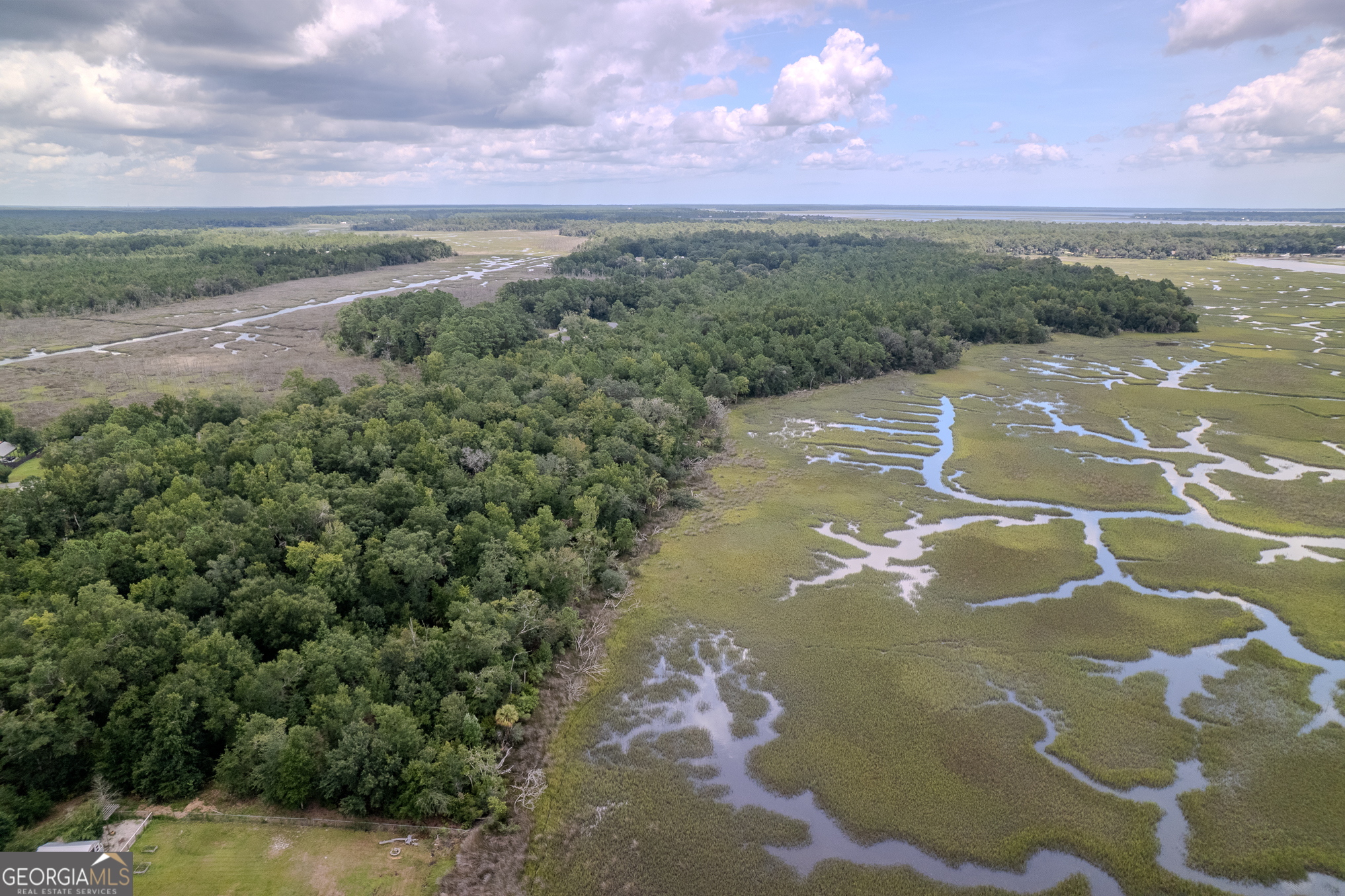 DISCOVER 6 ACRES OF PRISTINE WATERFRONT PROPERTY, INCLUDING 1.54 ACRES OF HIGH GROUND WITH SWEEPING MARSH AND RIVER VIEWS. THIS HOMESITE OFFERS THE PERFECT BALANCE OF PRIVACY AND CONVENIENCE: NESTLED AMONG MATURE TREES YET LOCATED LESS THAN THREE MILES FROM I-95 WITH PAVED ROAD ACCESS. POWER IS ALREADY BEING RUN TO THE PROPERTY AND IS INCLUDED IN THE PRICE. THE HIGH-GROUND PORTION LIES IN DESIRABLE "X" FLOOD ZONE WITH NO FLOOD INSURANCE REQUIRED. EVEN BETTER, THE PROPERTY SITS OUTSIDE CITY LIMITS, SAVING YOU ON CITY TAXES. ALL WATER, MINERAL, OIL, AND GAS RIGHTS WILL CONVEY WITH THE SALE. ADDITIONAL PARCELS, SOME ADJACENT, ARE ALSO AVAILABLE FOR PURCHASE.