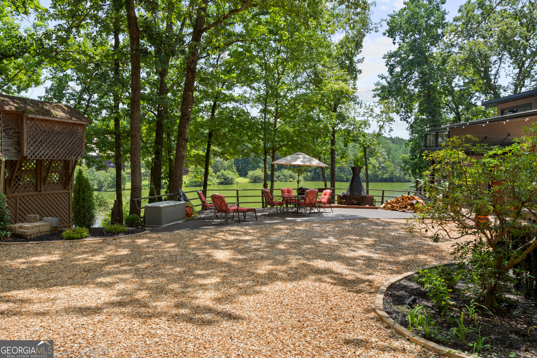 Located in the mountains of North Georgia, Mountain Lakes Resort is a gated RV and cabin community on the edge of the Chattahoochee National Forest. This private lake community offers a 50-acre stocked lake, fishing boats, paddle boats, a furnished clubhouse with gym, sauna, steam room, hot tub, dining, two outdoor pools, one indoor pool, waterslide, stables, horseback riding, hiking trails to a waterfall, putt-putt golf, playgrounds, seasonal events, community docks, paved roads, and 24-hour security. This property includes one deeded lot with year-round water views. Vacant lakefront lots in Mountain Lakes are rare, especially those with a grandfathered dock-one of which sits directly in front of the property. It's just a short walk to the water for fishing or kayaking.The resort is near Cleveland, GA, and the alpine-style town of Helen, GA, known for its local wineries, dining, waterfalls, and outdoor activities.