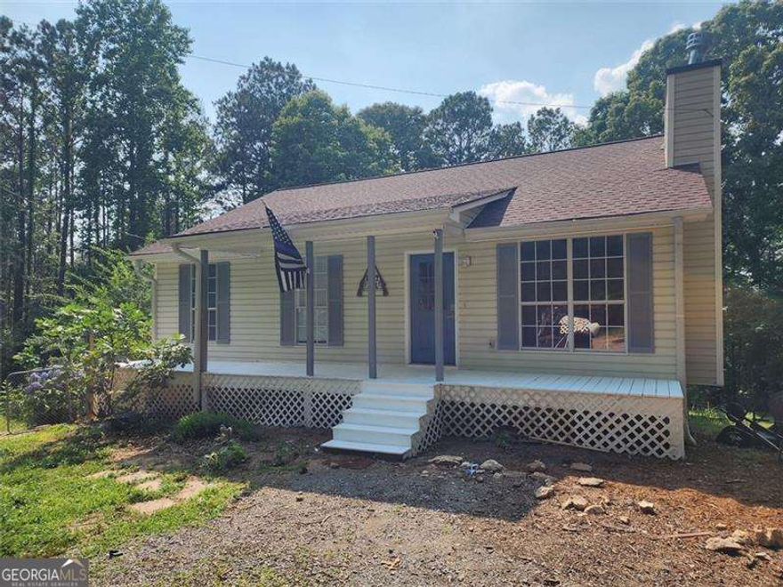 Be the first to see this property that features 6.6 acres of pure privacy, surrounding sounds of nature and the freedom to enjoy and explore your own piece of land. Long, recently leveled driveway guides the way to the adorable house positioned perfectly to soak in the abundant trees and endless possibilities of garden placements, livestock or fire pits to sit around with friends. The charming front porch provides gorgeous views of the property from several angles. This adorable ranch has hardwood floors throughout the main level, new bathroom flooring all just installed a few years ago. Cozy living room with fireplace and open sight lines to the kitchen make this a great place to host family and friends. The kitchen equipped with newer appliances and expansive island is ready for it's next entertainer or chef. Energy efficient French doors just steps away from the dining area usher back to the open sight lines of your private acreage on the new deck. Never worry about outgrowing this home with the full unfinished basement with both interior and exterior access. The layout of the basement is perfect for additional bedroom, bathroom and HUGE recreation room, media room, anything you could dream of. Just steps away from the terrace level entrance is a new 15 ft. by 40 ft. shop (with hurricane rated straps and beams). The building is on a concrete pad, has power access on every wall and light fixtures with Bluetooth capabilities. This space is perfect for ATV's, tractors or just a great space for storage or indoor/outdoor fun. This property provides endless opportunities for expansion, gardens, barns, family compound or just simple living on your own, secluded 6.6 acres.