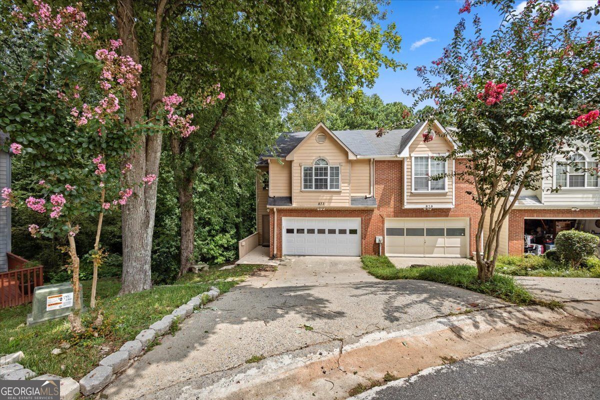 Beautifully updated three-story, end-unit townhouse nestled in a private cul-de-sac with breathtaking views of a serene lake and fountain with a large back deck. This 3-bedroom, 3.5-baths home boasts a finished basement, a 2-car garage, and countless upgrades, the HVAC is two years old, new LVP flooring offering both luxury and comfort. Gorgeous Granite and Trendy Paint Colors. Enjoy Cooking Out on the Back Deck Overlooking the Community Lake. Use the Basement as Extra Suite for Guests, In-Laws or Teens. This community is in Wheeler High School district, known for its acclaimed magnet program - an excellent option for those seeking academic enrichment. Don't miss this rare opportunity - schedule you showing today.