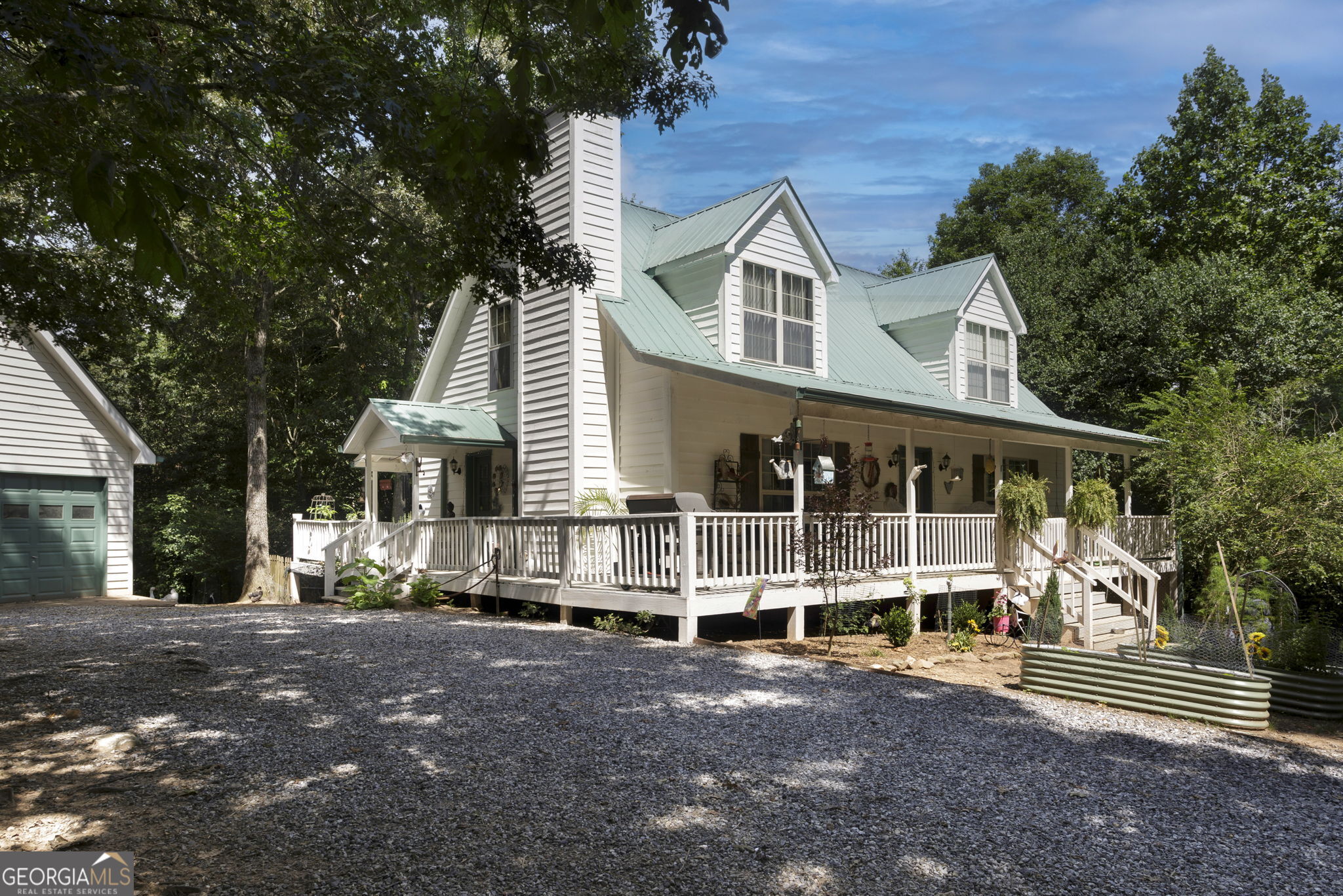 Working mini-farm just 4 miles from Lake Nottely! Bring your chickens, goats, alpacas, horses, donkeys . . . ! Farmhouse is a 3 BR, 3 full bath (plus downstairs in-law suite or apartment) on 11.18 acres in north Blairsville, Georgia. The home has two fireplaces - wood burning (but with gas line to convert) on main floor and gas downstairs. Primary bedroom and laundry are on the main floor. Private, gated (power gate with keypads for entry and exit) property with fencing around and within the property. Multiple outbuildings, including four barns (36x36 center-aisle stable with room for six individual stalls, or 5 stalls and tack room, 30x12 run-in barn, 22x12 run-in barn, 36x12 run-in barn), a chicken coop, large covered parking, and 2-vehicle garage with living/storage area above. This property is priced to sell!! NOTE: Shown by appointment only. Seller must be home for all showings to manage the farm animals.