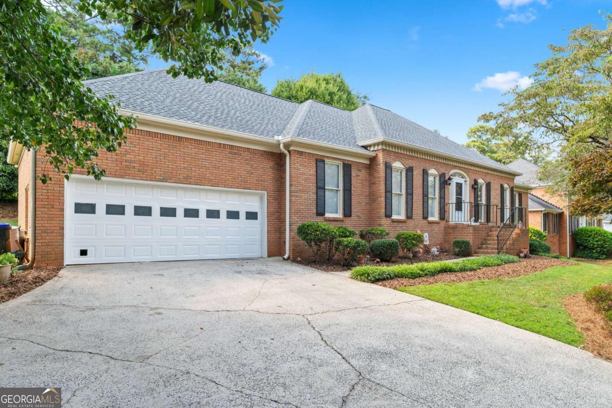 Welcome to this impressive 3 bedroom, 3.5 bathroom brick ranch that combines comfort, functionality, and timeless charm. Situated in a desirable Roswell community, this home offers abundant space inside and out, along with access to fantastic neighborhood amenities. From the moment you arrive, you'll notice the thoughtful details-three garages, two designated driveway parking spots, a brand new roof (October 2024), brand new water heather (August 2025) and a Rain Bird sprinkler system that makes maintaining the landscaped yard effortless. Inside, the heart of the home is the expansive kitchen featuring an eat-in area, new cooktop, new garbage disposal, a breakfast bar, and plenty of cabinetry for storage. You will also find your own private full bath in one of the secondary bedrooms. The adjoining living room is warm and welcoming with its cozy brick fireplace and a private wet bar, creating the perfect gathering spot. The oversized primary suite provides a private retreat with a spa-like ensuite boasting double vanities, a large soaking tub, and a separate shower. Two spacious secondary bedrooms and additional bathrooms ensure comfort for family and guests. The unfinished basement presents incredible potential-whether you need abundant storage or envision a future recreation room, gym, or media space. Step outside to enjoy a private backyard oasis, ideal for entertaining or relaxing. The community offers resort-style living with access to a pool, tennis courts, pickleball, a clubhouse, and a playground.