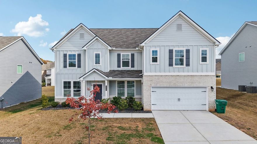 Located at 1547 Stinson Lane, Locust Grove, GA, this residential property in Henry County presents an attractive opportunity to own a home in great condition. Built in 2022, this property offers contemporary living spaces designed for comfort and style. The heart of this home is undoubtedly its open floor plan, which encourages a sense of togetherness and provides ample space for both relaxation and entertainment. The living room, featuring a fireplace, offers a warm and inviting atmosphere, perfect for cozy evenings spent with loved ones. The kitchen is a chef's dream, complete with a large kitchen island that serves as a focal point for meal preparation and casual dining. Stone countertops provide a touch of elegance and durability, while shaker cabinets and a stylish backsplash add to the kitchen's overall aesthetic appeal, making it a pleasure to cook and gather in this space. This property, boasting 3849 square feet, also includes the convenience of a dedicated laundry room, further enhancing the home's functionality. This is more than just a house; it is a place to create lasting memories.