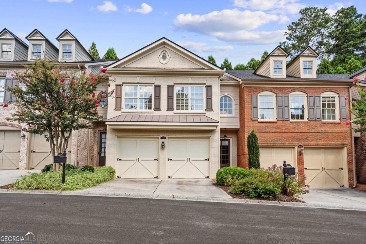 Beautiful John Willis townhome in gated Smyrna-Vinings community along the Silver Comet Trail! Close to restaurants like South City Kitchen or the West Village nearby. Neutral painted interior, newer carpet, and gleaming hardwoods throughout main level. Spacious kitchen boasts granite countertops, double ovens, and gas cooktop. New HVAC! Open great room includes gas fireplace and overlooks private courtyard. Oversized master suite with vaulted ceilings, double vanities, walk-in closet and sitting room. Fantastic location just minutes to I-285 and Braves Stadium.
