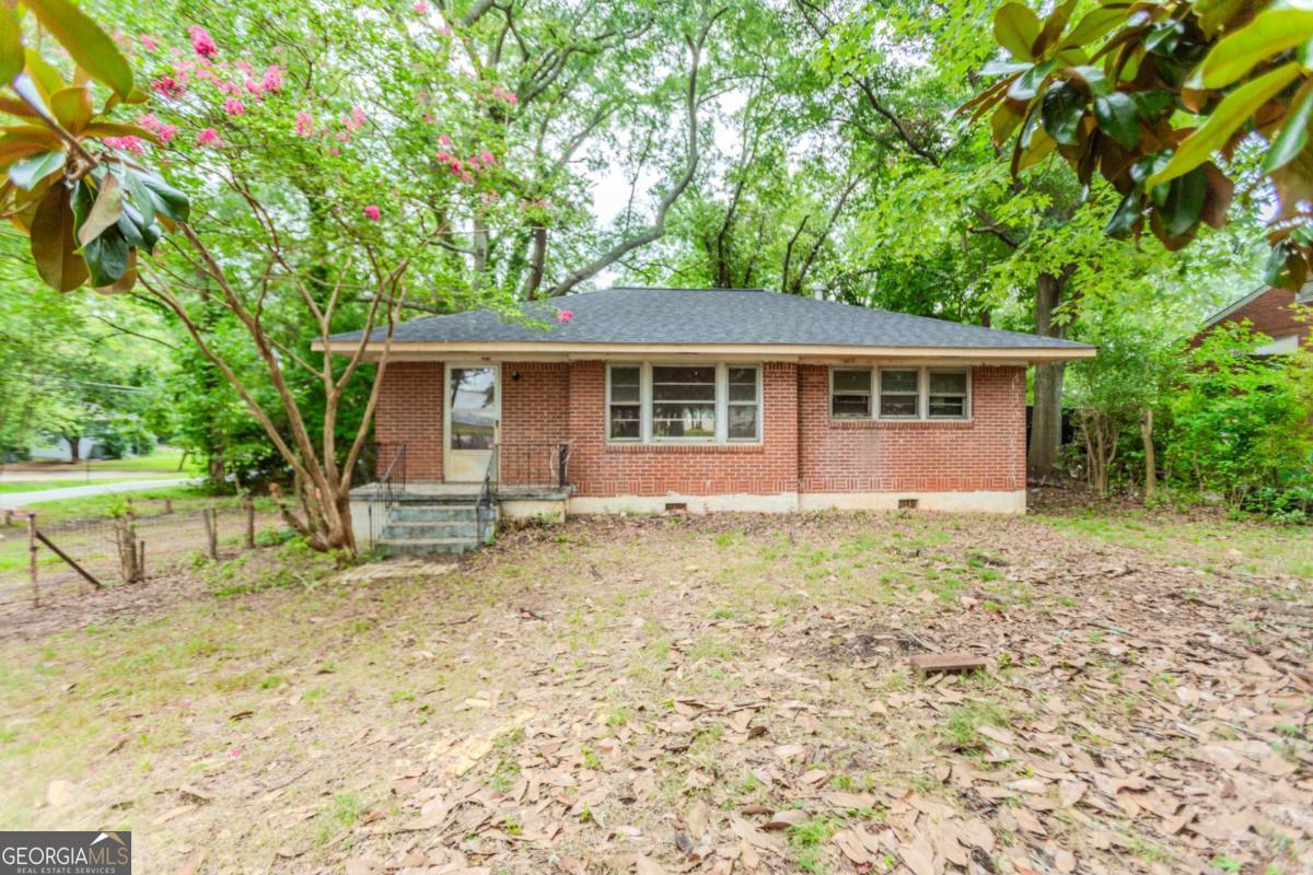 INVESTORS, TAKE NOTICE! Here's your chance to capitalize in the red-hot Forest Park neighborhood! This solid 3-bedroom, 1-bath, four-sided brick ranch is full of untapped potential. Built in 1950, it sits on a desirable corner lot and boasts a brand-new roof-just the foundation you need for a profitable project. Inside, you'll find a spacious living area that flows easily from the kitchen-perfect for opening up the floor plan or enhancing your entertainment space. The original hardwood floors add character, and the smart, efficient layout provides plenty of room for upgrades. Outside, the property includes a carport and a large backyard, offering endless possibilities for creating your own outdoor oasis. And with unbeatable access to I-75, I-85, I-285, downtown Atlanta, and Hartsfield-Jackson Airport, you're never far from the action. Whether you're planning a fix-and-flip or looking to expand your rental portfolio, this prime opportunity won't last long. Bring your vision-this one is ready for transformation!