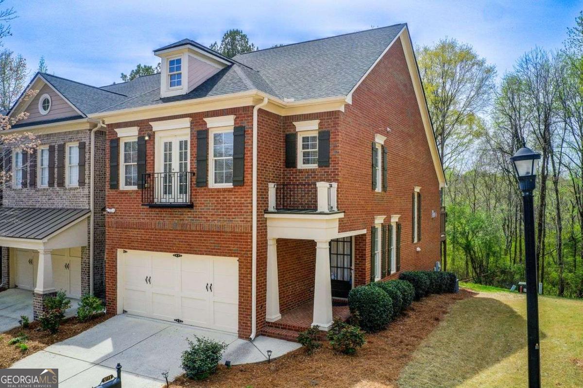 UP TO $21,950.00 IN DOWN PAYMENT AND CLOSING COSTS ASSISTANCE!! Unique floorplan with space galore in this gorgeous John Weiland resale. Multi level END UNIT brick home located in beautiful gated Providence subdivision! Once you step into the spacious light elegant foyer, you will know you are home! High ceilings, built in bookcases, skylights, cozy gas fireplace, large dining area and beautiful large kitchen make this open concept main living area a spectacular masterpiece. Off of the living room there is a deck over the downstairs patio with a soothing wooded view. The house has just received a new roof, has been completely newly painted and brand new carpeting in all the comfort areas and stairways. There is a large loft/den/game room/bonus room upstairs overlooking the main living area. This is a perfect retreat for an active family. The owner's suite is a true sanctuary.