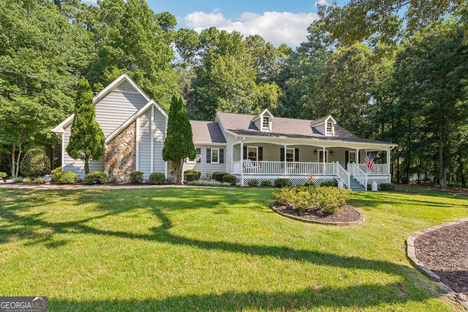 A solid ranch-style cottage in Forsyth Schools, no HOA, in an established community, and one that is meticulously maintained does not come on the market often! This 3-bed, 2-bath home offering a split floor plan designed for comfort and functionality. Right off the expansive front porch, step inside to find gleaming hardwood floors, a well-suited foyer, cozy living area with a fireplace, and a bright kitchen featuring stainless steel appliances, abundant cabinetry, and a cheerful view of the backyard. The primary suite includes double vanities, floor to ceiling tiled walk-in shower, a spacious closet, and plenty of space to unwind. Two additional bedrooms provide flexible options for guests or family. Need more space? A large unfinished bonus room above the garage offers incredible potential-finish it to create a home theater, office, guest suite, or even an income-producing rental. Outdoor living is just as inviting with a welcoming front porch, a private back patio with retractable awning, and beautifully landscaped grounds filled with mature trees and shrubs. Additional highlights include a laundry room, ample storage, and an unfinished attic with expansion opportunities. Located at 2840 Bryant Court, this home is nestled in one of the most sought-after areas of Forsyth County, known for its top-notch schools and vibrant, community-focused living. You're also just moments from the Cumming City Center, a beloved neighborhood hub featuring unique boutiques, local restaurants, scenic green spaces with pocket parks, walking and biking trails, public art, and the charming Lou Sobh Amphitheater. Whether you're seeking exceptional education, community charm, or convenience to dining and recreation, this property offers it all.