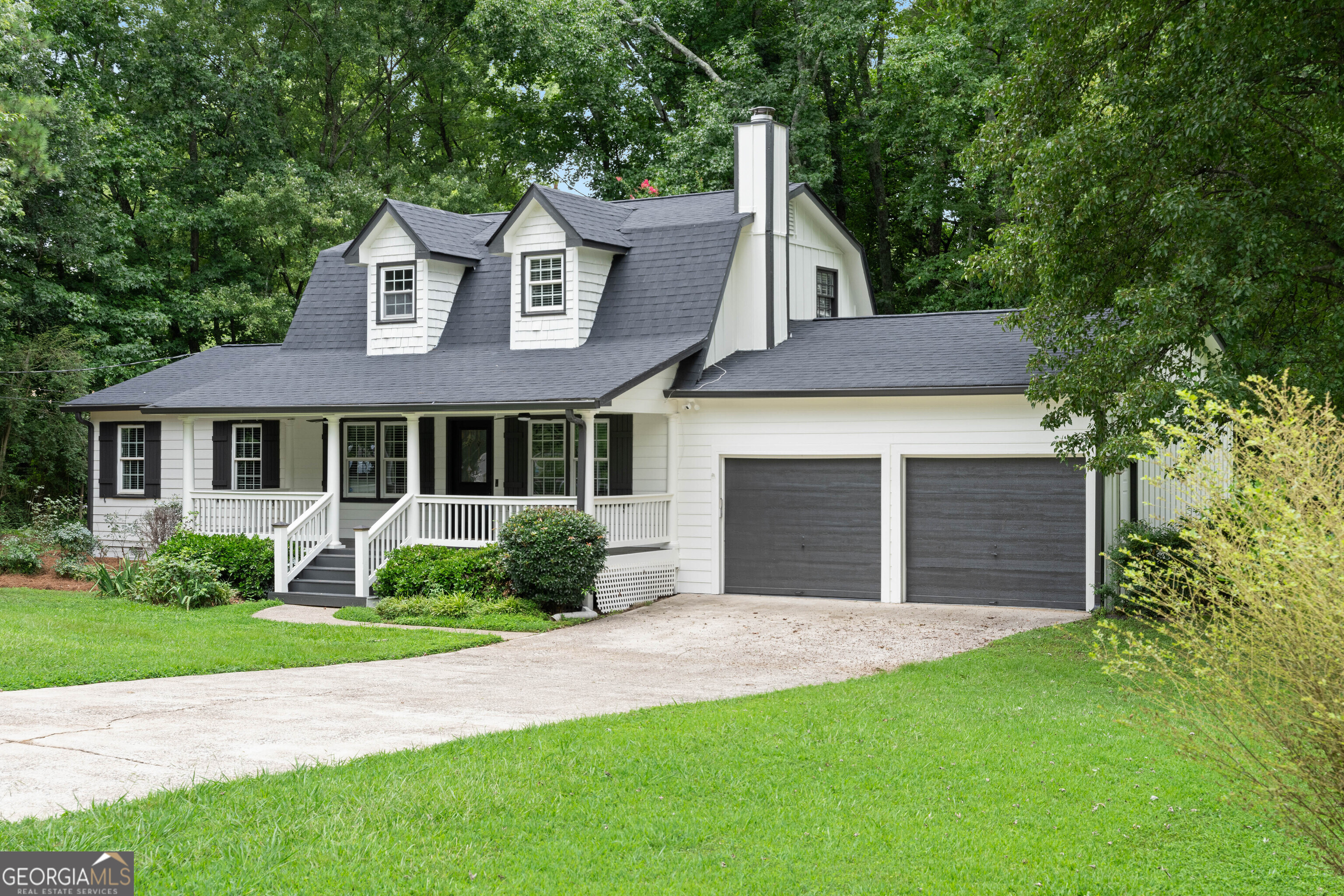 JUST REDUCED! MOTIVATED SELLER!!! Welcome Home! Discover this charming Ranch-style home tucked away in one of East Cobb's most established and desirable communities. Situated on a beautiful corner lot, this property has been newly renovated and features a brand-new roof with a 10-year transferable warranty. From the moment you arrive, you'll be captivated by the spacious front porch, perfect for rocking chairs and enjoying your morning coffee. The exterior was professionally painted in August 2025, giving the home fresh curb appeal. Step inside to a welcoming foyer that opens to a cozy family room and an open-concept floor plan with seamless views into the kitchen and dining area. The fully renovated kitchen boasts luxury quartz countertops, a stylish new backsplash, all-new stainless steel appliances, a modern vent hood, and updated light fixtures throughout.The primary suite on the main level is bright and spacious, offering a fully renovated bathroom with a quartz double vanity, a beautifully tiled shower, and new lighting. Upstairs, you'll find two additional large bedrooms, while all bathrooms including the powder room have been tastefully updated.Enjoy outdoor living on the walk-out deck, ideal for patio furniture and entertaining guests. The large, level backyard is perfect for kids, pets, and family gatherings. All of this in an amazing location, just minutes from Marietta Square, close to shopping, dining, and in a top-rated school district (Pope High School).