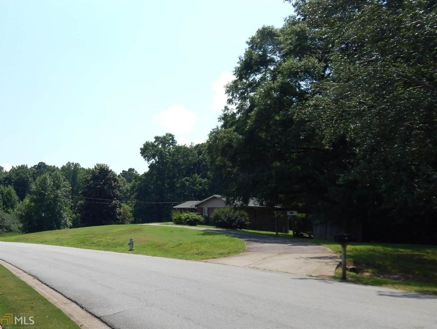 (BEST LAND VALUE IN NORTH GEORGIA) "23 GORGEOUS ACRES" Borders the "NATIONAL FOREST" on two sides, in High Demand Buford GA area.  Perfect to build your private dream home or several estate homes with forever privacy-deer & wildlife. Only a short walk to the Chattahoochee River and less than a mile & half to Lake Lanier, State Parks, Camping, Boating and Hiking trails. Convenient to schools, shopping, restaurants, I-85 or GA-400. This beautiful tract of land can fit all your dreams or needs. There is an existing two bedroom 4-sides brick home with full basement, barn & shed all sold "As-Is" At this price it want last long, HURRY!