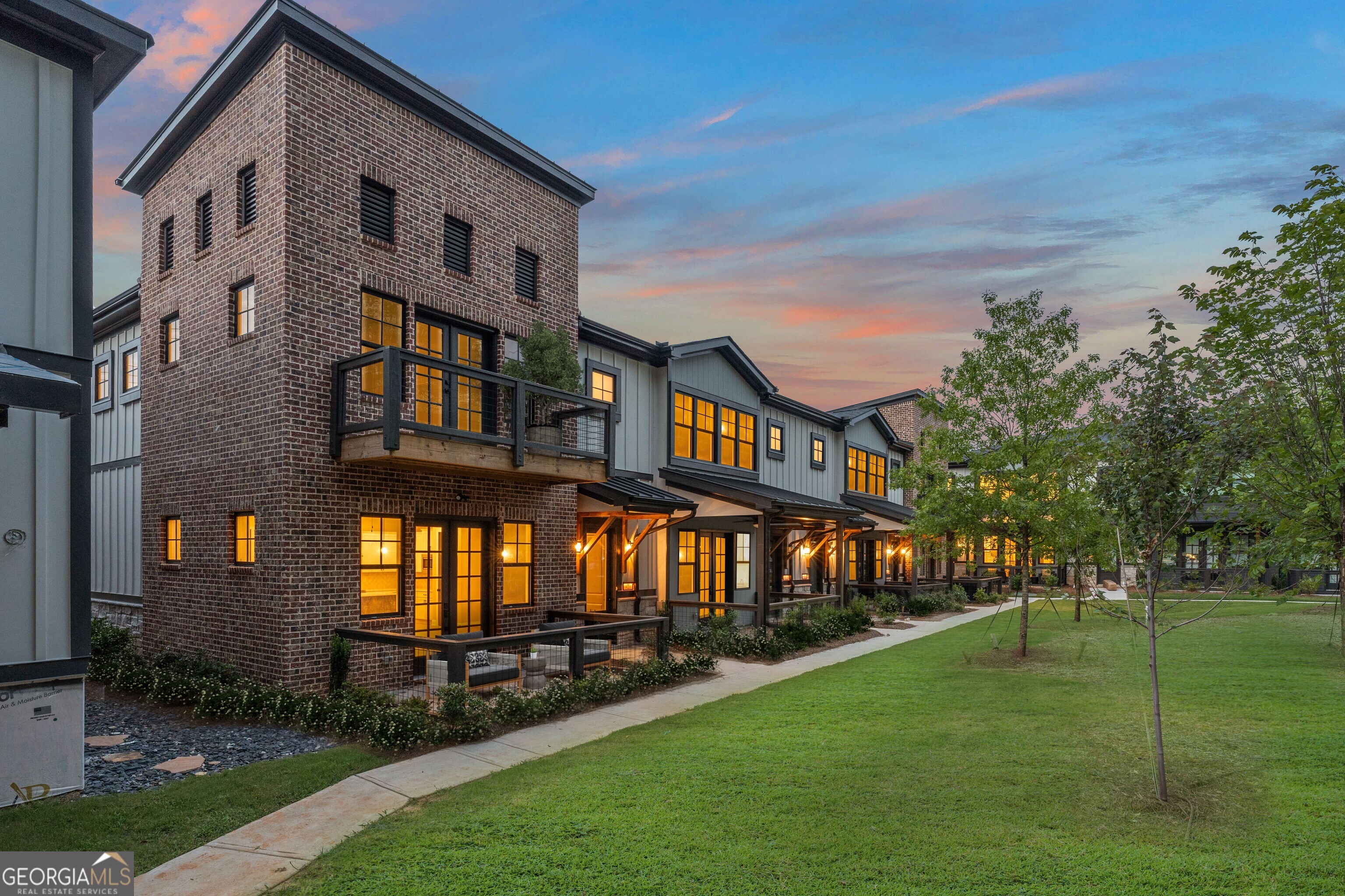 Now selling from the mid $400's-Serenity is a small community of 25 spacious townhomes in vibrant Hapeville, GA, with up to 2,050 sq ft of living space. These two-story homes feature open-concept living and dining, Stunning kitchens with islands and dry bars, optional fireplaces, rear-entry 2-car garages, and front porches. Upstairs includes a large owner's suite with double vanities and oversized walk-in closet, plus two additional bedrooms with walk-in closets and a full laundry room. Lot 9 is ready now! Serenity townhomes include high-efficiency R-38 attic insulation, 17-SEER zoned HVAC, Low-E windows, and a smart energy package. Exteriors feature fiber cement siding, brick accents (per plan), professional landscaping, 30-year architectural shingles, and lawn irrigation. Interiors offer 10' ceilings (main), LVP flooring, designer lighting, and black hardware finishes. Kitchens are equipped with 42" painted cabinets, granite countertops, subway tile backsplash, stainless appliances, and a pantry. Owner's suites feature walk-in closets, granite vanities, and tiled showers. Additional features include a smart garage opener, 50-gal water heater, and a comprehensive builder warranty. Come home to Serenity Located just minutes from downtown Atlanta and Hartsfield-Jackson Airport, Serenity offers walkability to Hapeville's artsy downtown, eclectic dining, and creative spaces. Close to Porsche HQ, Delta, and Chick-fil-A's original Dwarf House, this community blends modern comfort with convenience and culture.