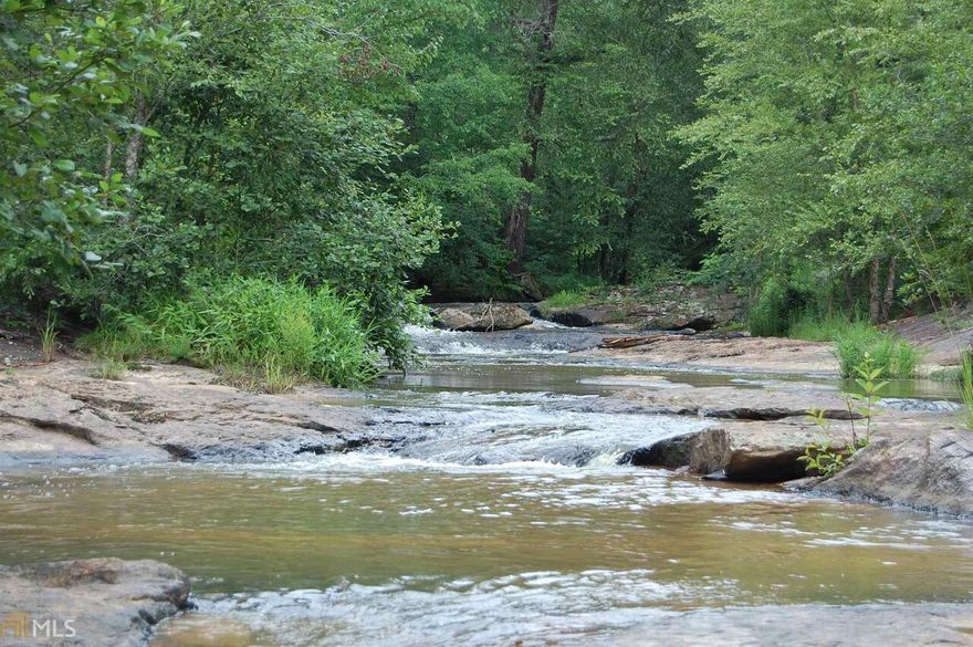This is your chance to own one of the best tracts offered in Middle Georgia. This tract offers: Huge Hardwoods, Well managed mature pine stands, Crystal clear creeks, Numerous lake sites, Roaring waterfalls and Natural rock outcroppings that would make you think you were in the mountains, Lots of road frontage, Great interior road systems and so much more. Owner will divide. Bring all offers!!!