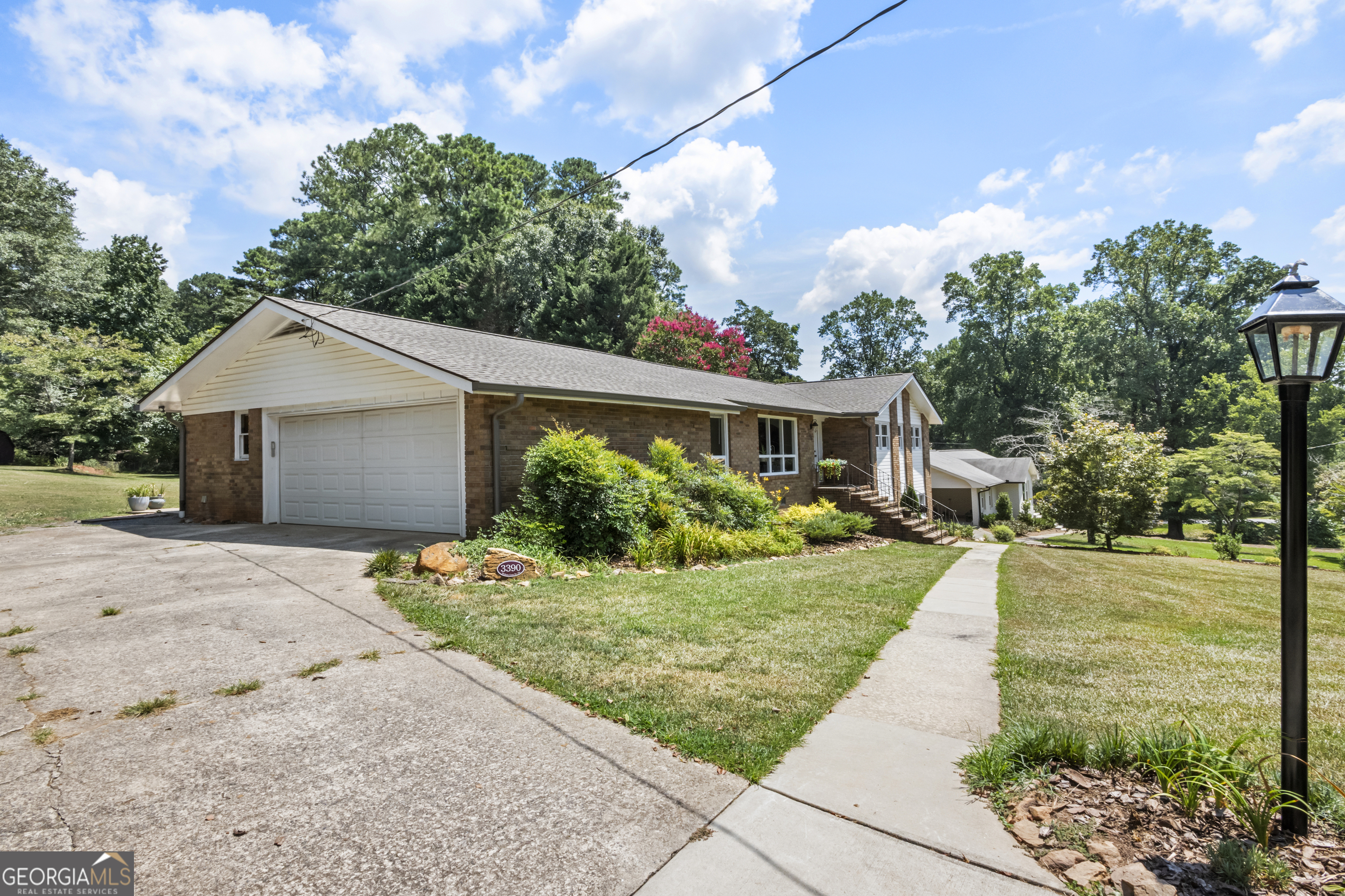 West Cobb. Here's your opportunity to own 1.9 acres of land featuring fruit trees in a very private setting. This charming 4-sided brick ranch includes a full basement and a sunroom that overlooks your secluded backyard. Located within the Harrison High School district, you'll be close to shopping, dining, and pickleball courts just down the road. The basement boasts a bonus room that can serve as a fourth bedroom, along with a couple of additional rooms. Best of all, there is NO HOA! Don't miss out on this fantastic opportunity.