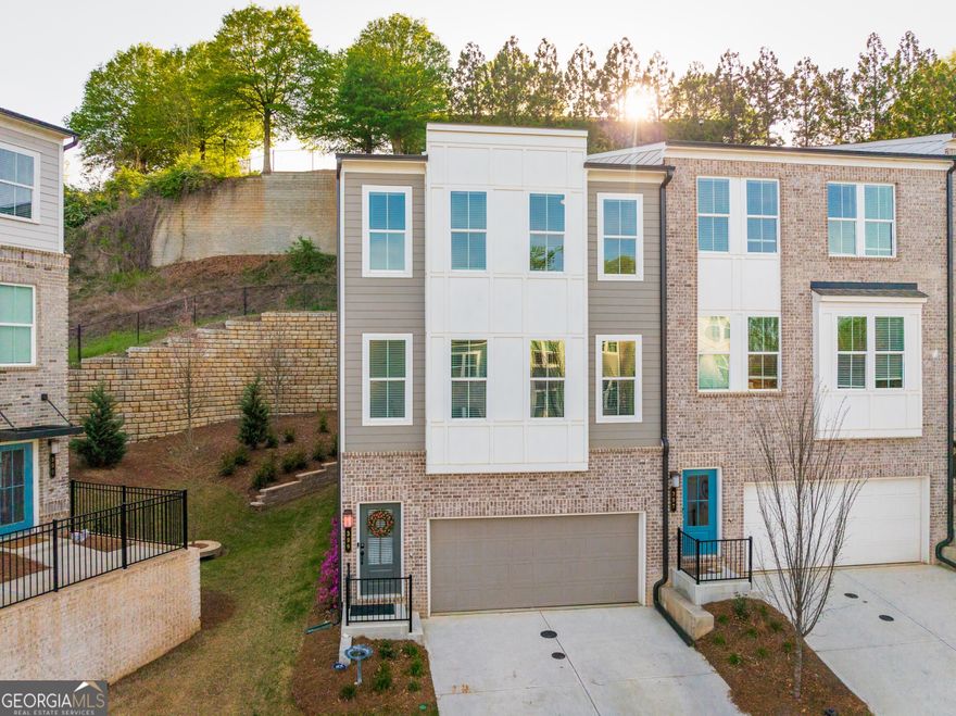 A Unicorn in the neighborhood: Built two years ago, this lovely home is almost 600 square feet bigger than most units! Corner unit with 21 windows and custom blinds, making it light, bright and airy. A true terrace level with private patio, a half bath and walk-in closet unlike the newer builds where the ground level feels like a basement. Large 2 car garage and driveway! Extra long kitchen island that is double the width of most other units. High end appliances are included too!  These are just a few of the unique features that make this a spectacular investment, and more importantly, a great big new adventure in living. The gourmet kitchen steals the show with quartz counters, high-end appliances, and an extra-wide island that doubles your entertaining space. Flow seamlessly through the airy dining and living areas or step out to your private deck for brunch, cocktails, or BBQs.  Upstairs, unwind in a spa-inspired owner's suite with soaking tub, walk-in shower, and dual closets. Two additional bedrooms offer flexible space for guests or creative pursuits.   The versatile terrace-level bonus room offers flexibility for a guest suite, fitness studio, home office, or media lounge. A two-car garage with 220 volt charging keeps life easy and future-ready.  Best of all, your lifestyle is amplified by location: minutes from Grant Park, The Beacon, Summer Hill and all the best of Atlanta. And to top it all off, it is steps from the new addition to the Beltline. This is the ultimate blend of modern sophistication, hip city living, and a peaceful retreat to call your own.  Live Bold. Relax Deep. Love Living. Especially here.  Come on home to HAPPY today!