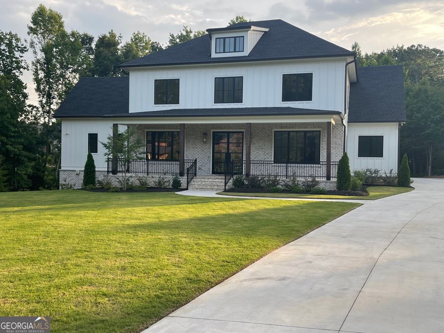 Welcome to this newly constructed home at 1645 Mayfield Rd in Alpharetta, GA. This charming residence features spacious living areas, a modern kitchen with high-end applicances, and a tranquil backyard appropriate for relaxation. The home offers ample natural light and elegant finishes throughout, complemented by cozy fireplaces in the living room and the porch. Located near both Downton Alpharetta and Downtown Milton, this property provides convenient access to local amenities and top-rated schools. 1.6 acre yard. Master bedroom on main and 4 bedrooms on 2nd floor. Unfinished basement with 10 foot ceilings. 3-car garage. Hardwood flooring throughout. A must-see gem in Alpharetta!